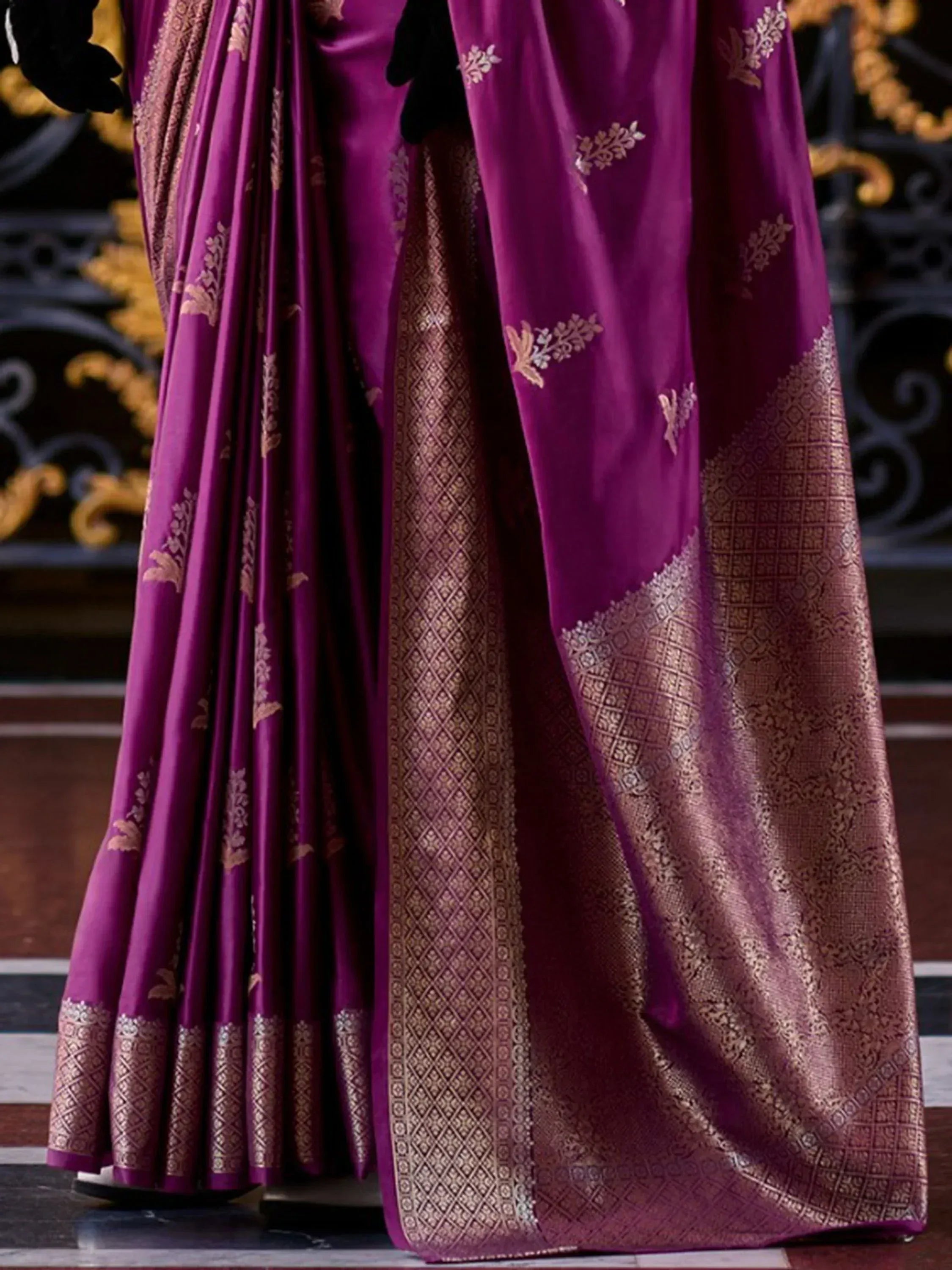 Rich purple saree with gold floral embroidery and intricate border, perfect for Indian ethnic wear occasions.