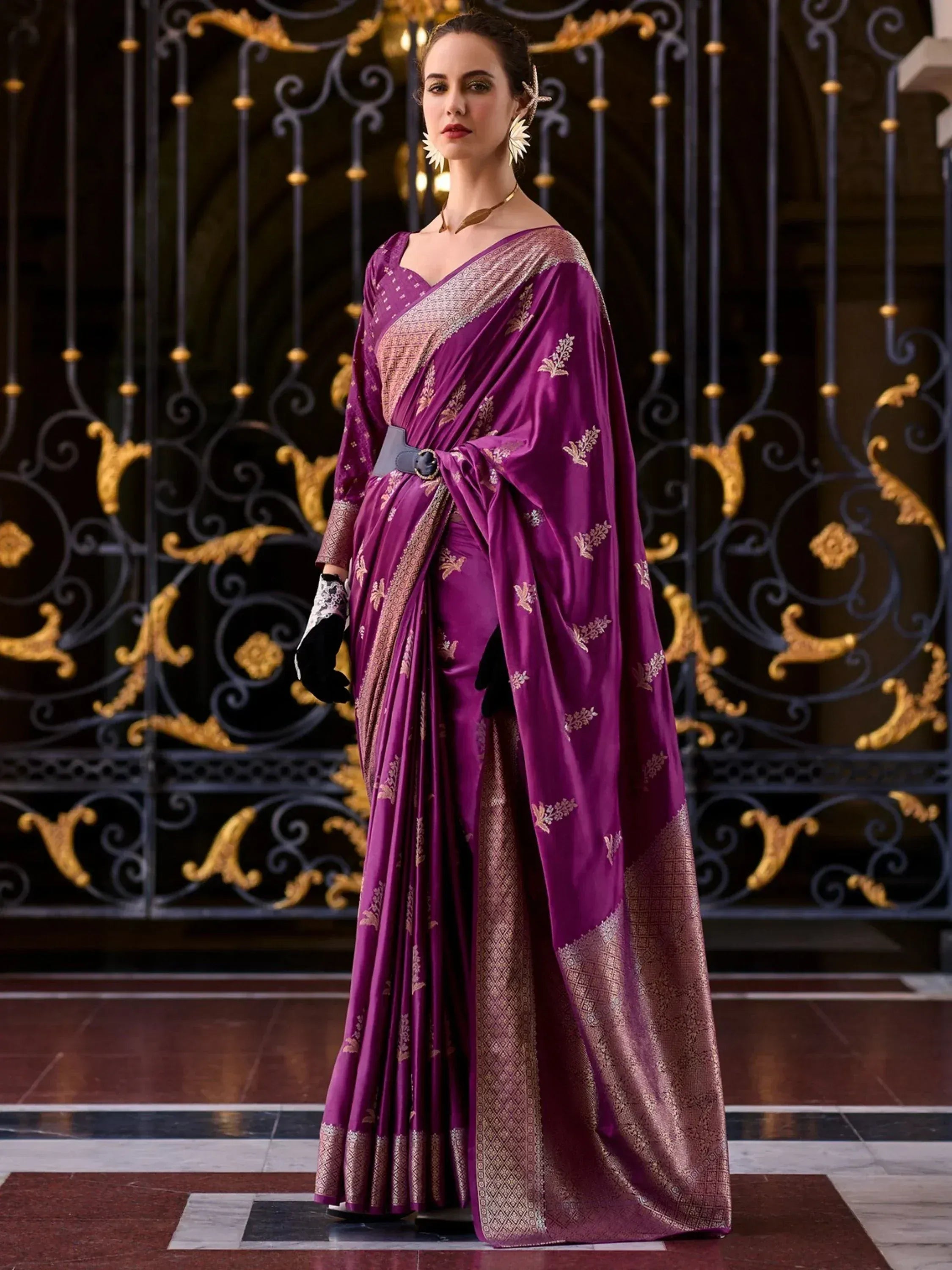 Purple designer saree with gold embroidery, modern drape, and belt accent for ethnic wear