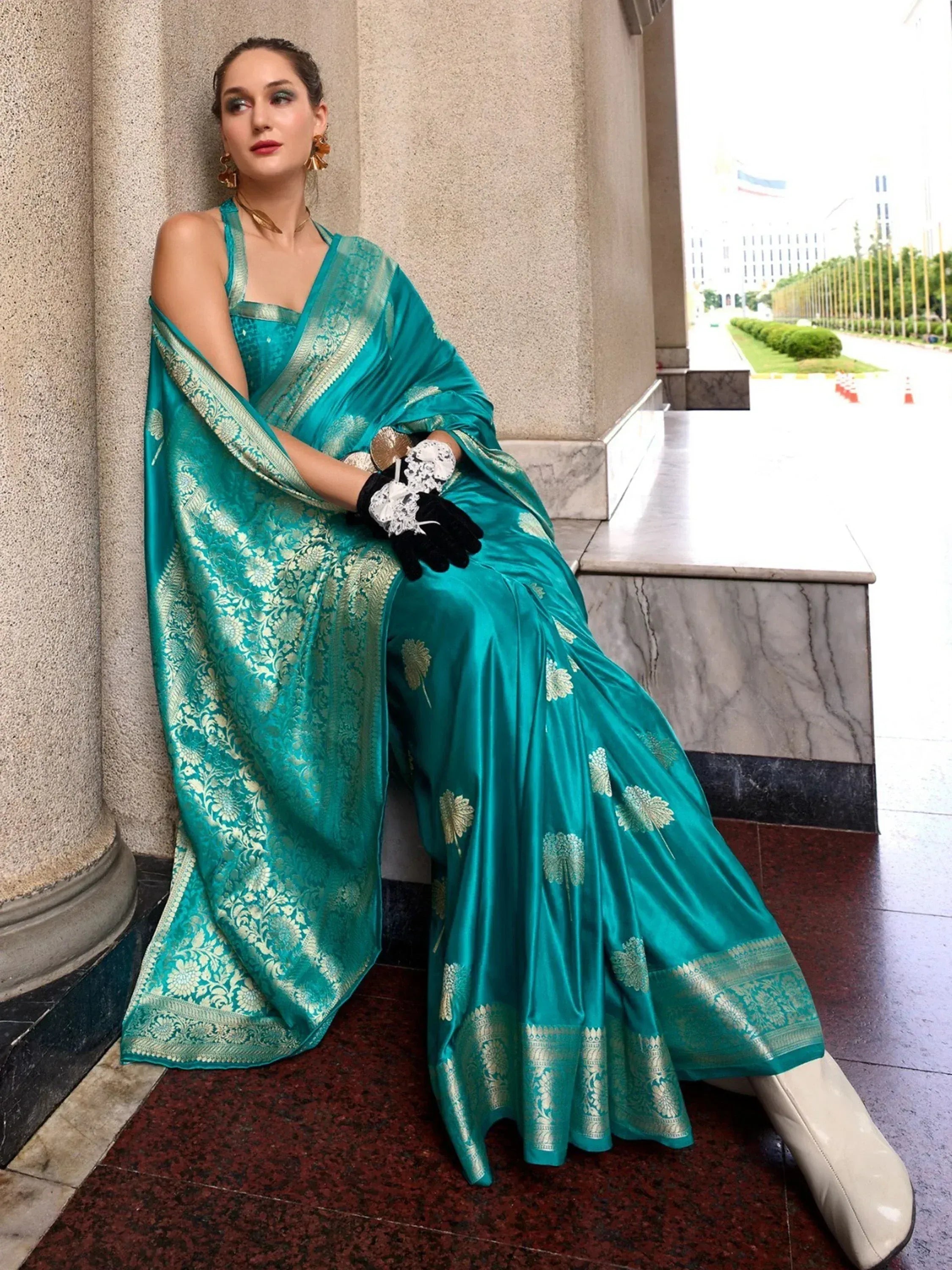 Teal designer saree with gold floral embroidery, perfect for Indian ethnic wear occasions