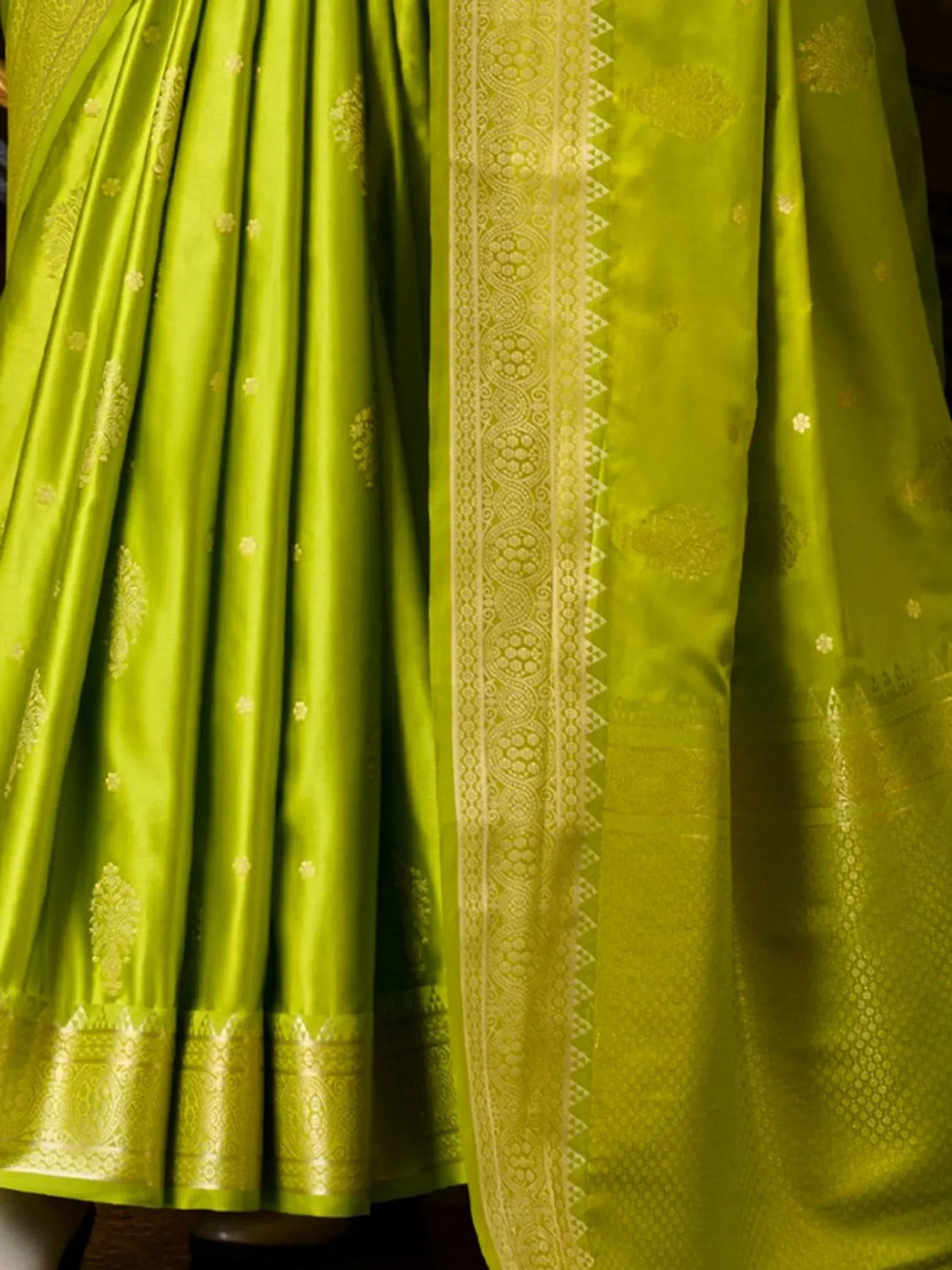 Lime green silk saree with gold floral motifs and intricate border, Indian ethnic wear