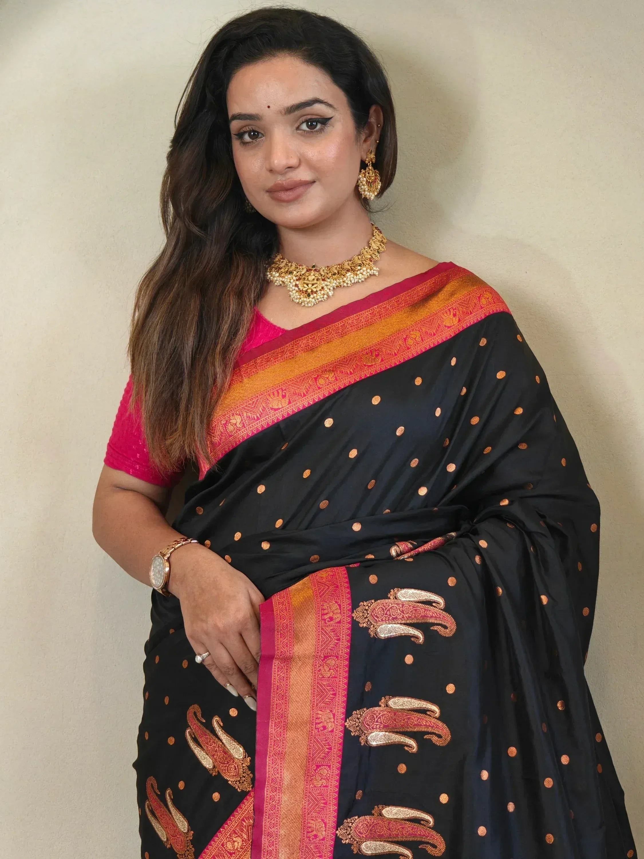 Black saree with gold paisley and polka dots, pink blouse, traditional Indian ethnic wear