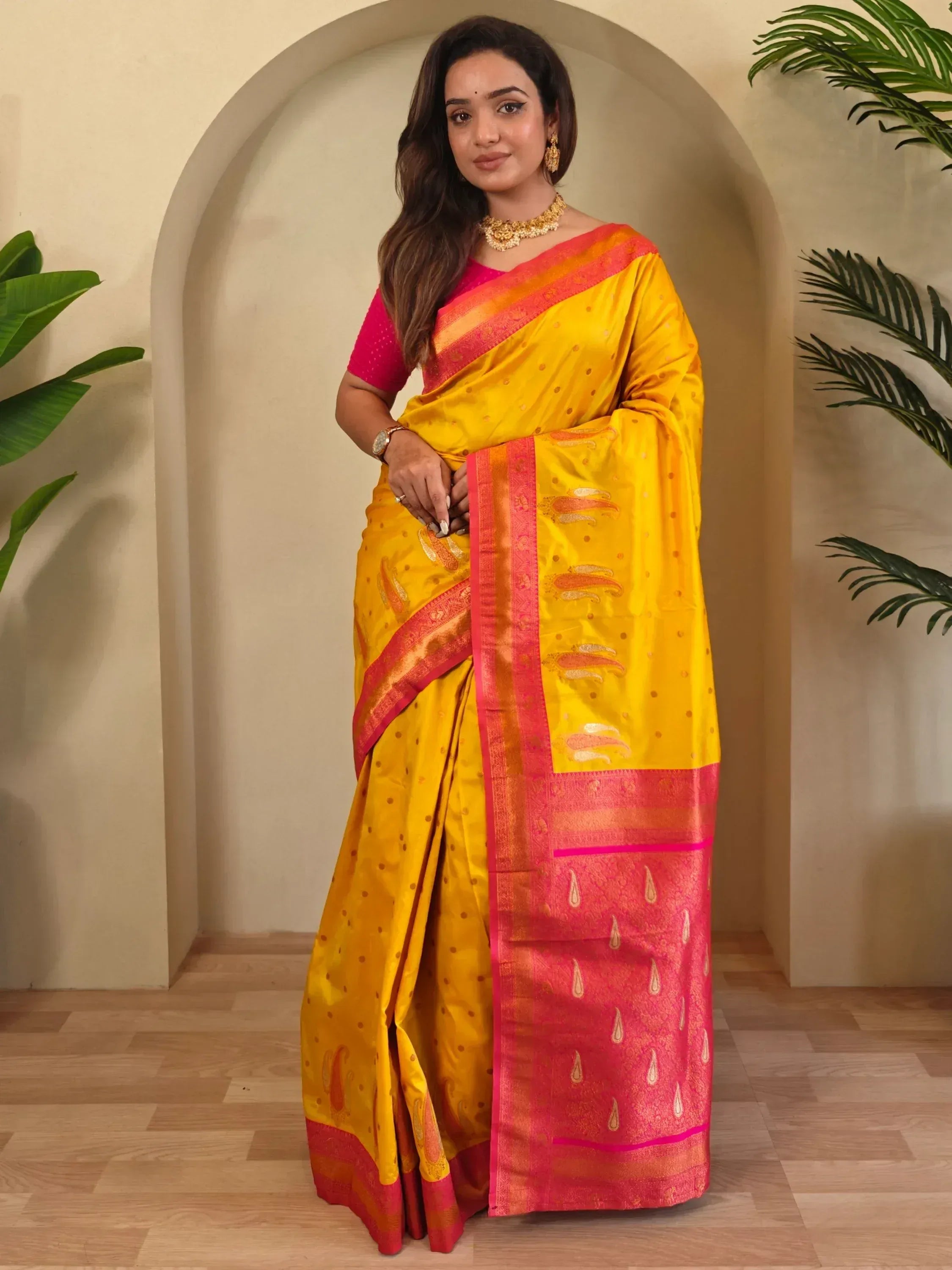 Yellow and pink designer saree with gold motifs, perfect for Indian ethnic wear occasions