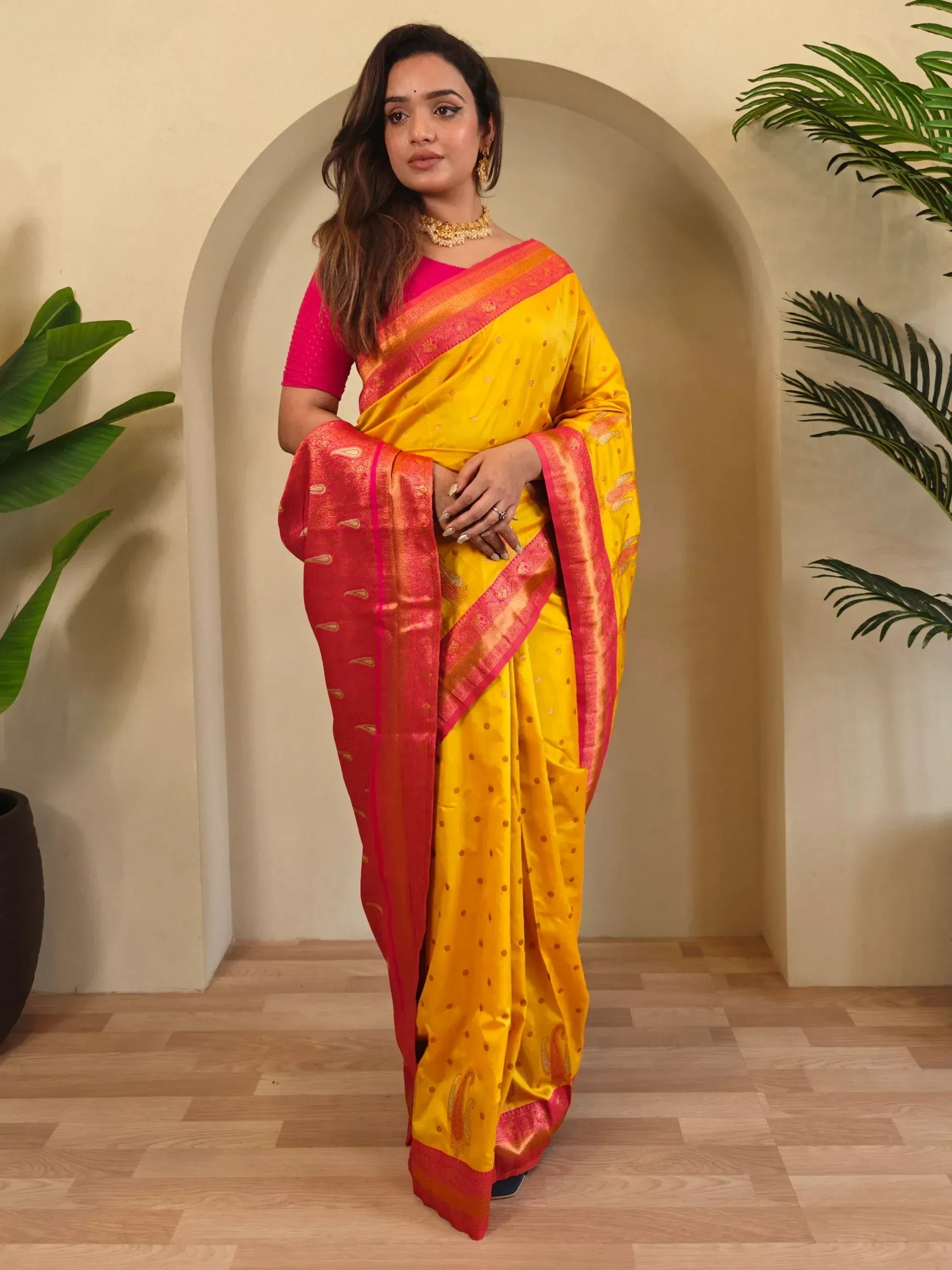 Yellow and pink designer saree with gold motifs, perfect for Indian ethnic wear occasions