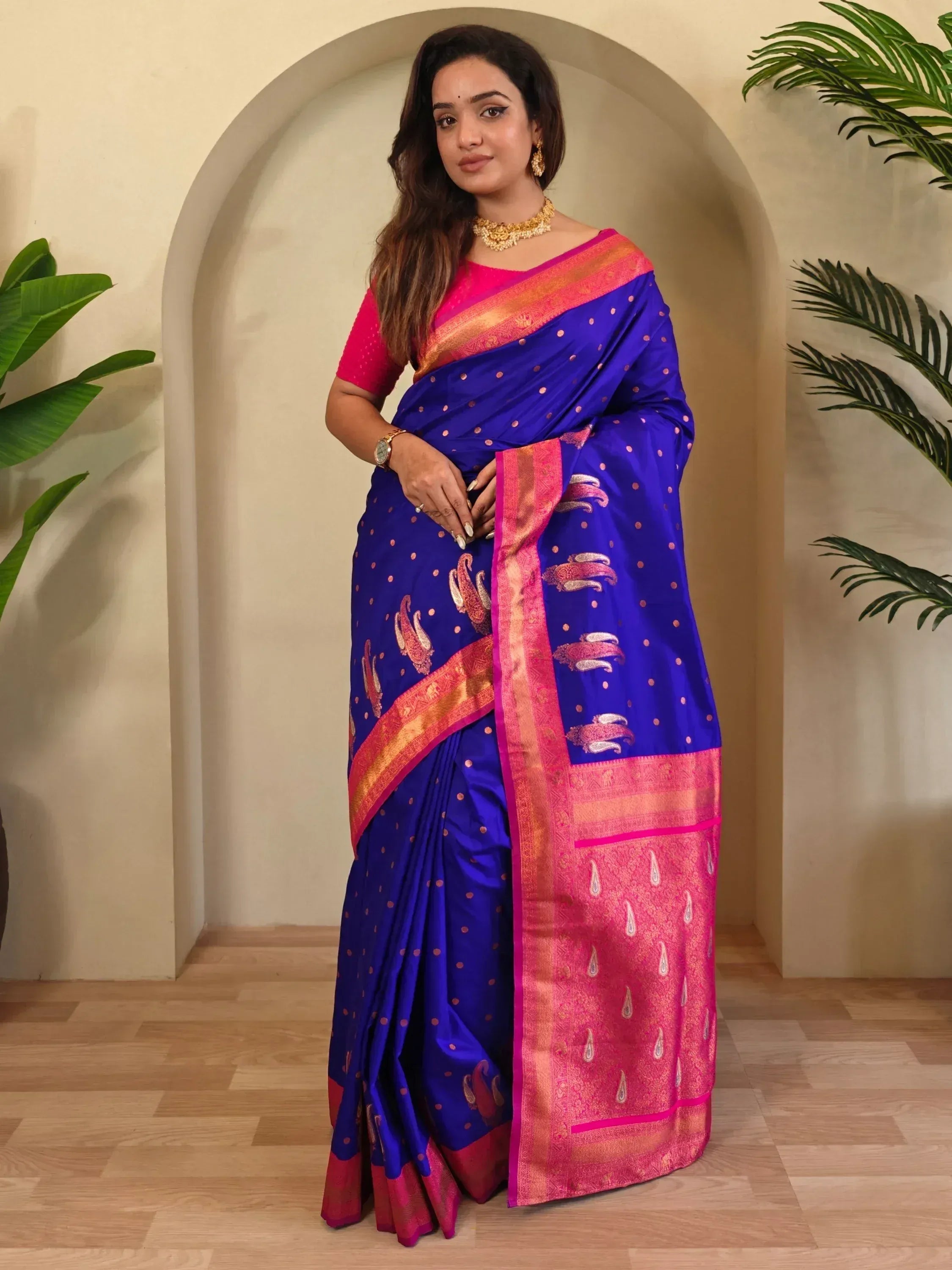 Royal blue silk saree with pink border and paisley motifs, paired with matching blouse for Indian ethnic wear