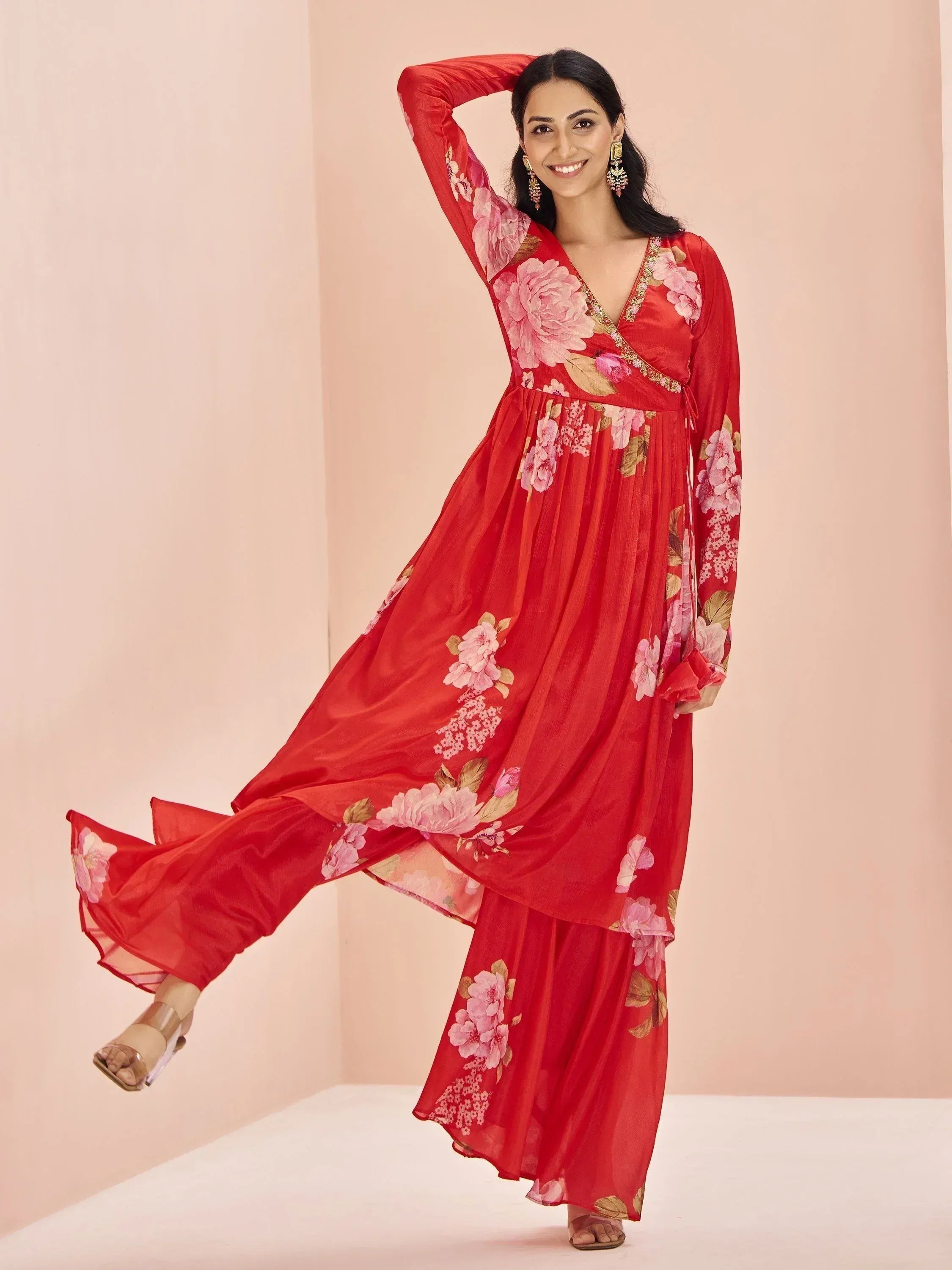 Red floral ethnic gown with V-neck and wide sleeves, perfect for Indian occasions