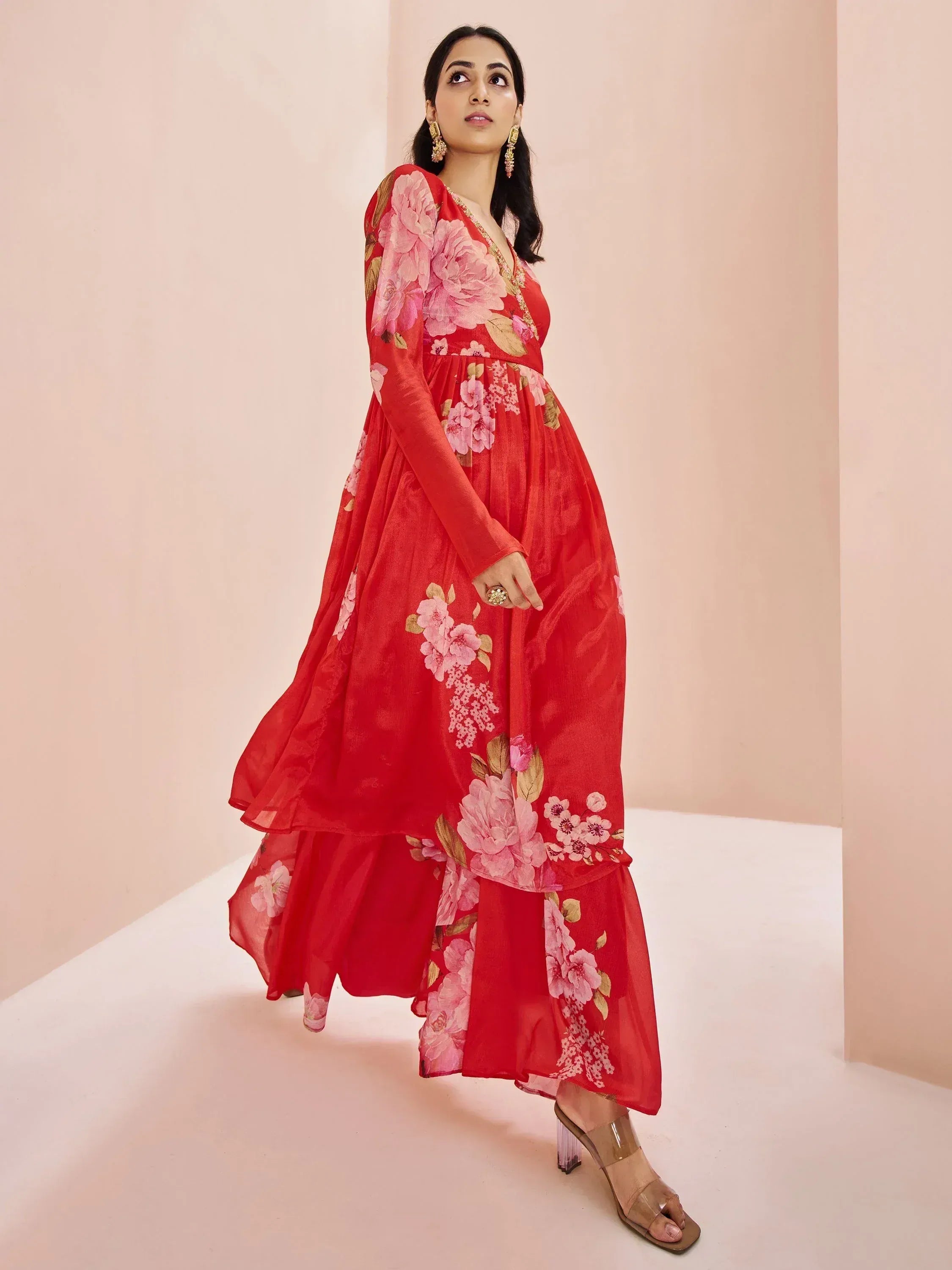 Red floral ethnic gown with pink peony print, long sleeves, and layered skirt for women