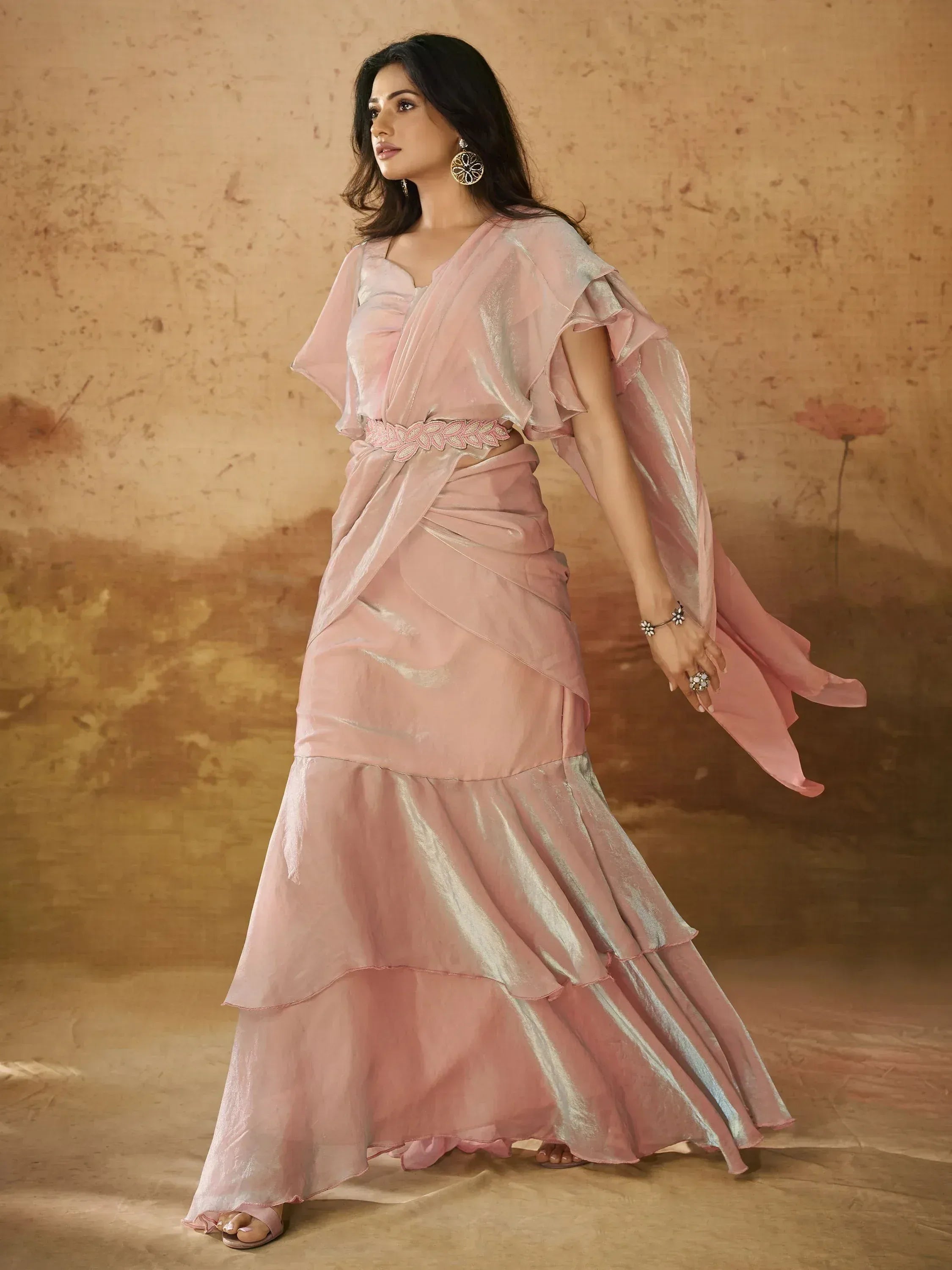 Pink ethnic gown with ruffled sleeves and tiered skirt, perfect for Indian occasions