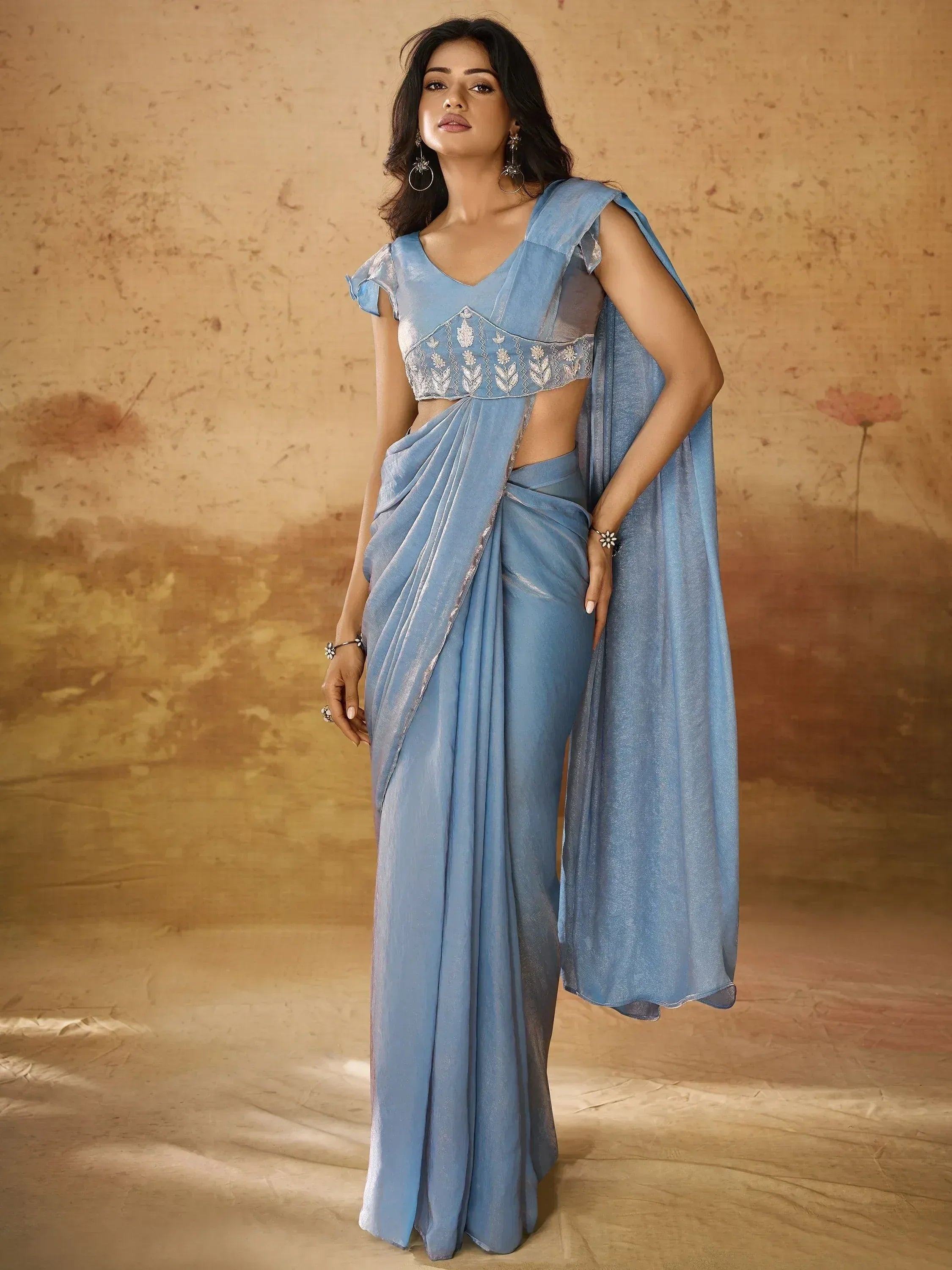 Light blue ethnic saree with embroidered blouse, perfect for Indian occasions and festive wear.