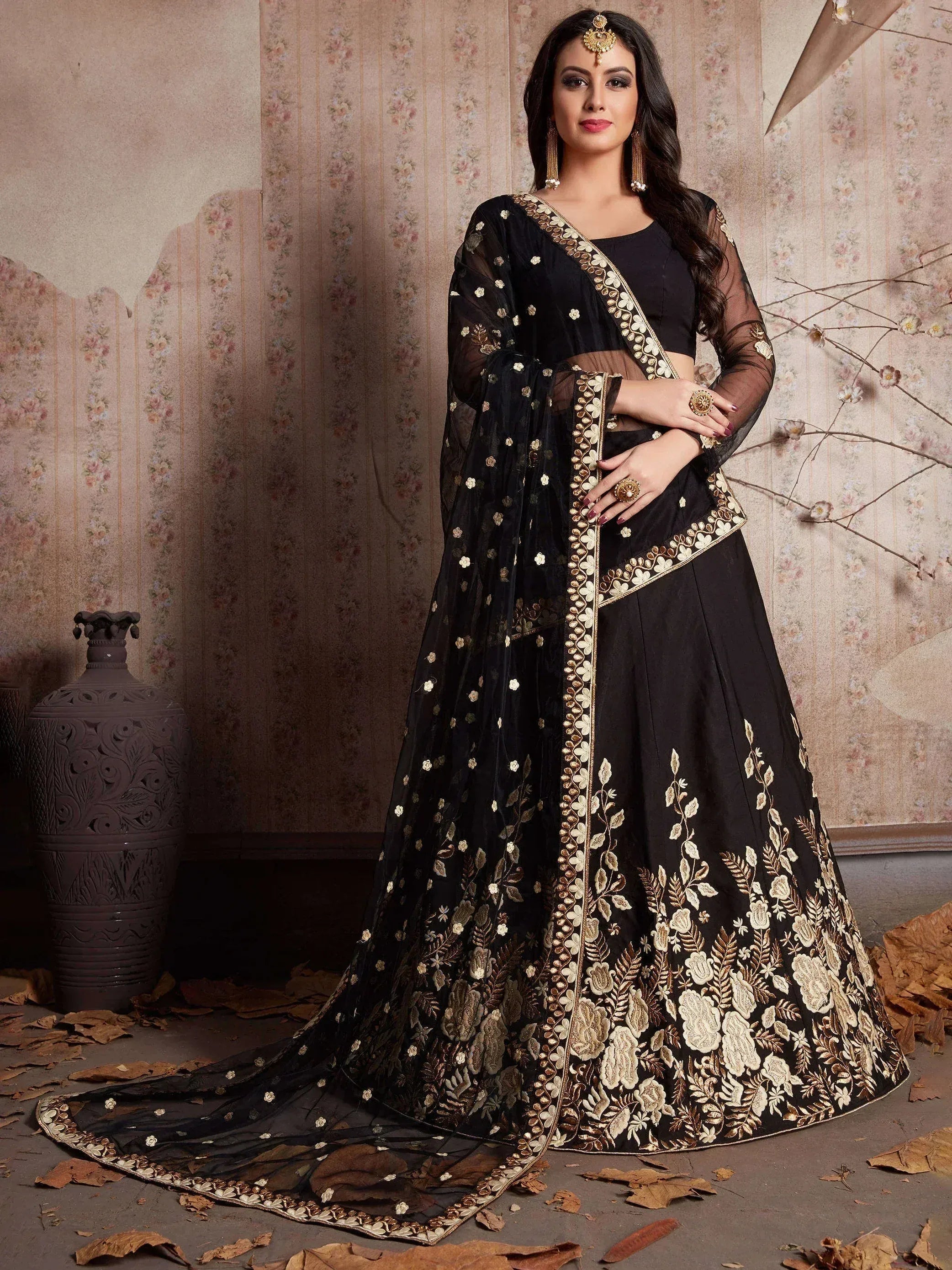 Black embroidered lehenga choli with gold floral work, sheer dupatta, perfect for Indian weddings and festive occasions