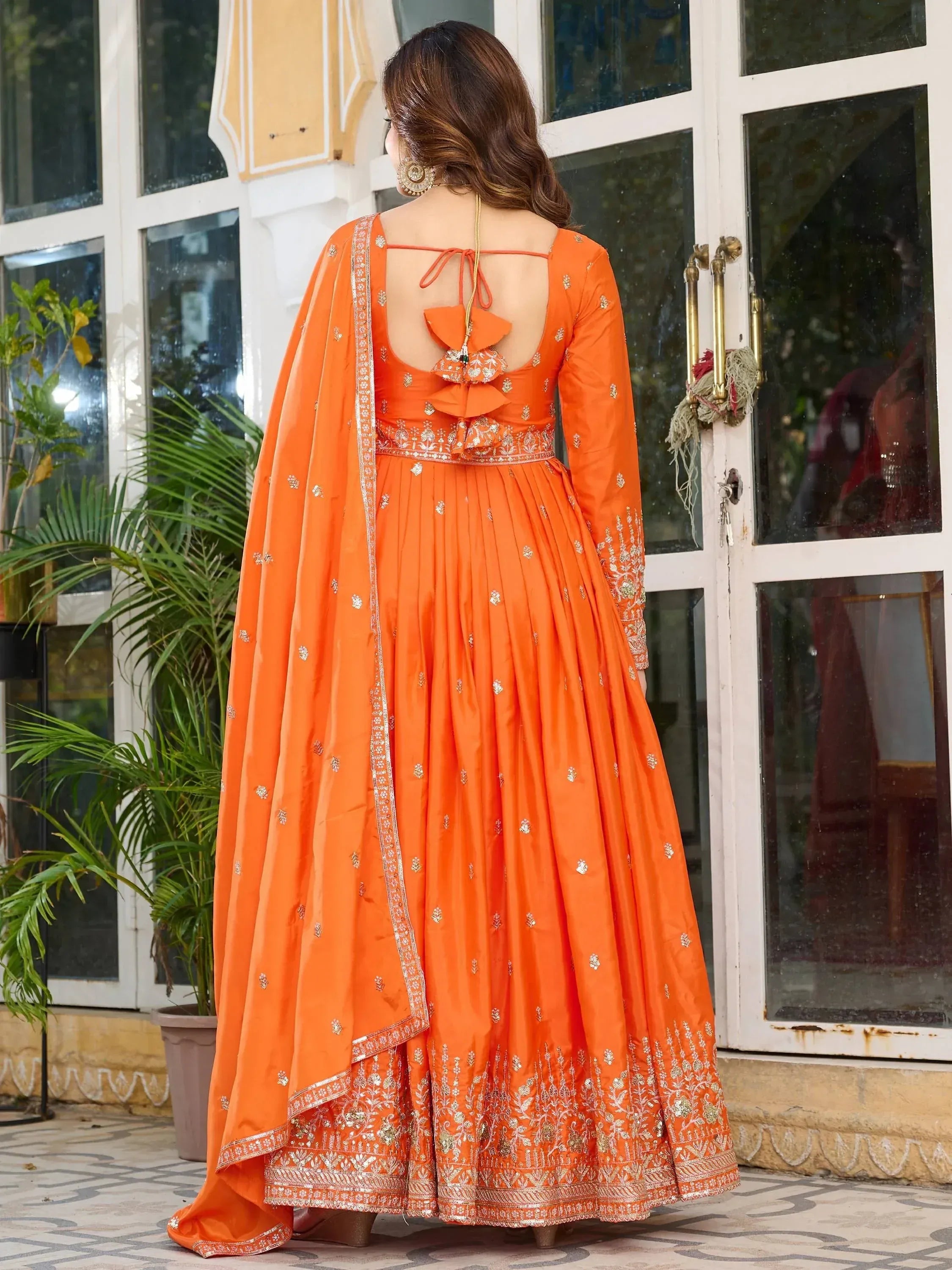 Orange embroidered anarkali suit with back tie detail, perfect for Indian ethnic occasions