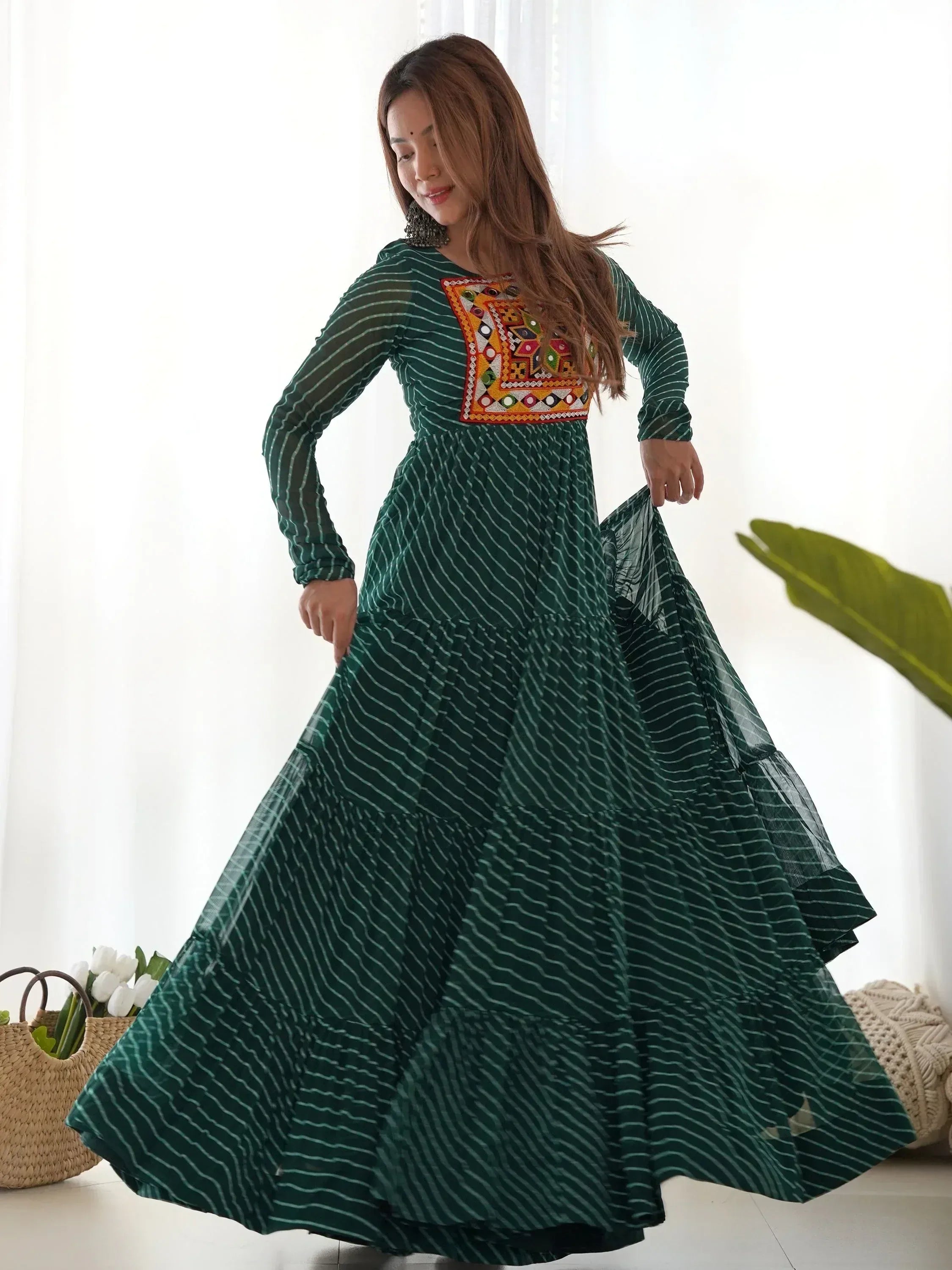Green striped ethnic gown with colorful mirror work, perfect for Indian occasions and festive wear.