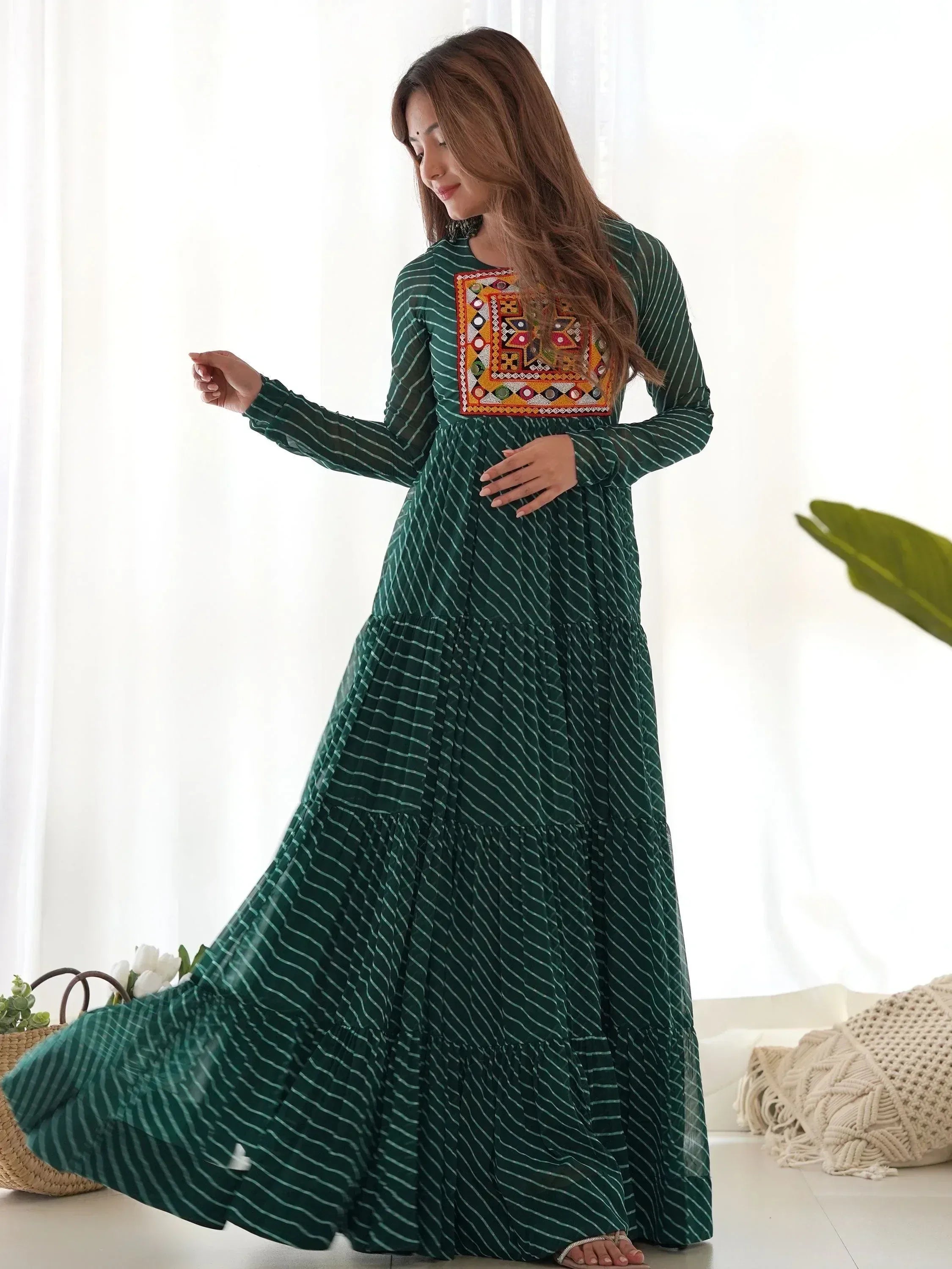 Green striped ethnic gown with mirror work, perfect for Indian occasions and festive wear.