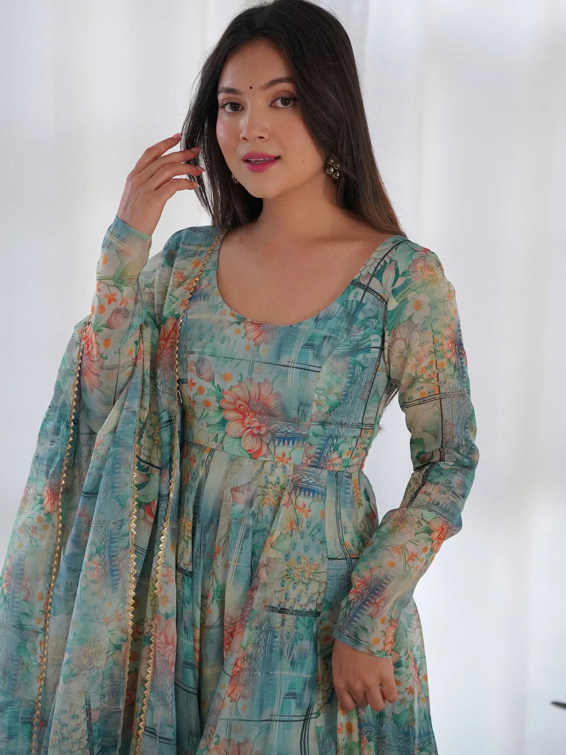 Floral print ethnic gown with gold trim, perfect for Indian occasions and festive wear.