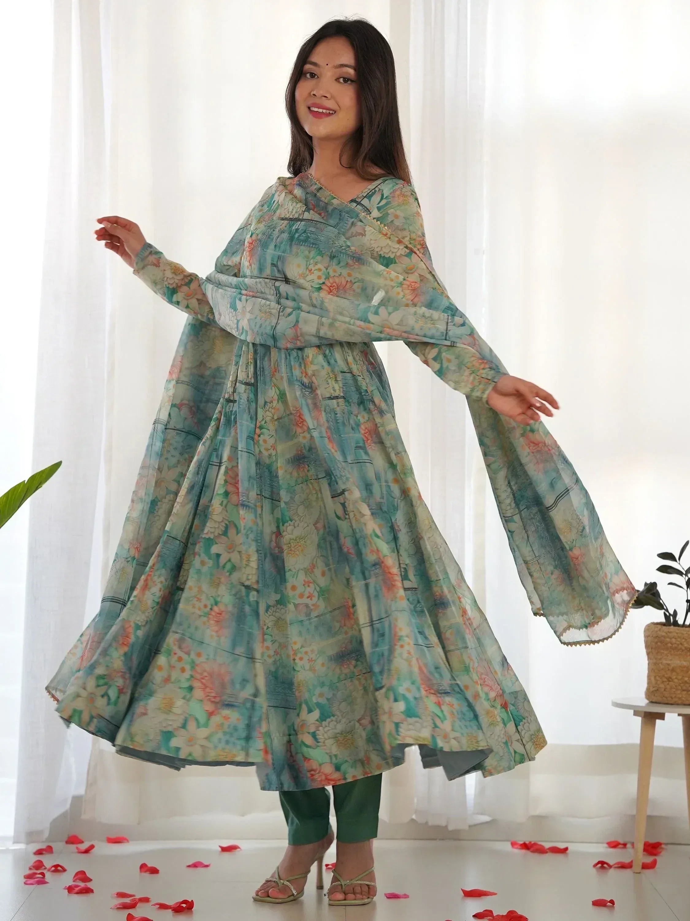 Floral print ethnic gown with wide sleeves, paired with green pants, perfect for Indian occasions