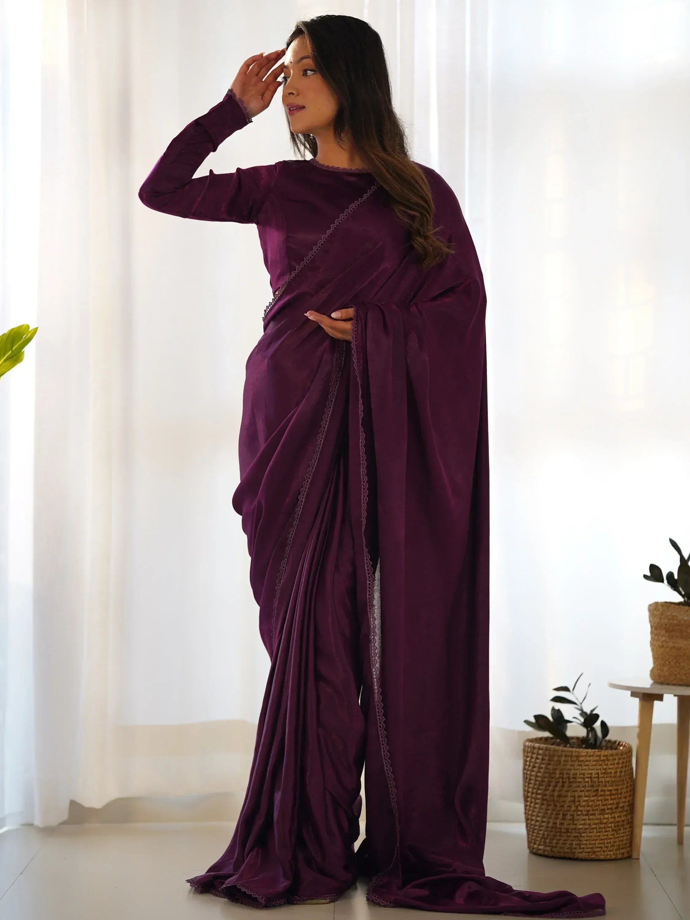 Elegant purple saree with lace detailing, perfect for ethnic occasions