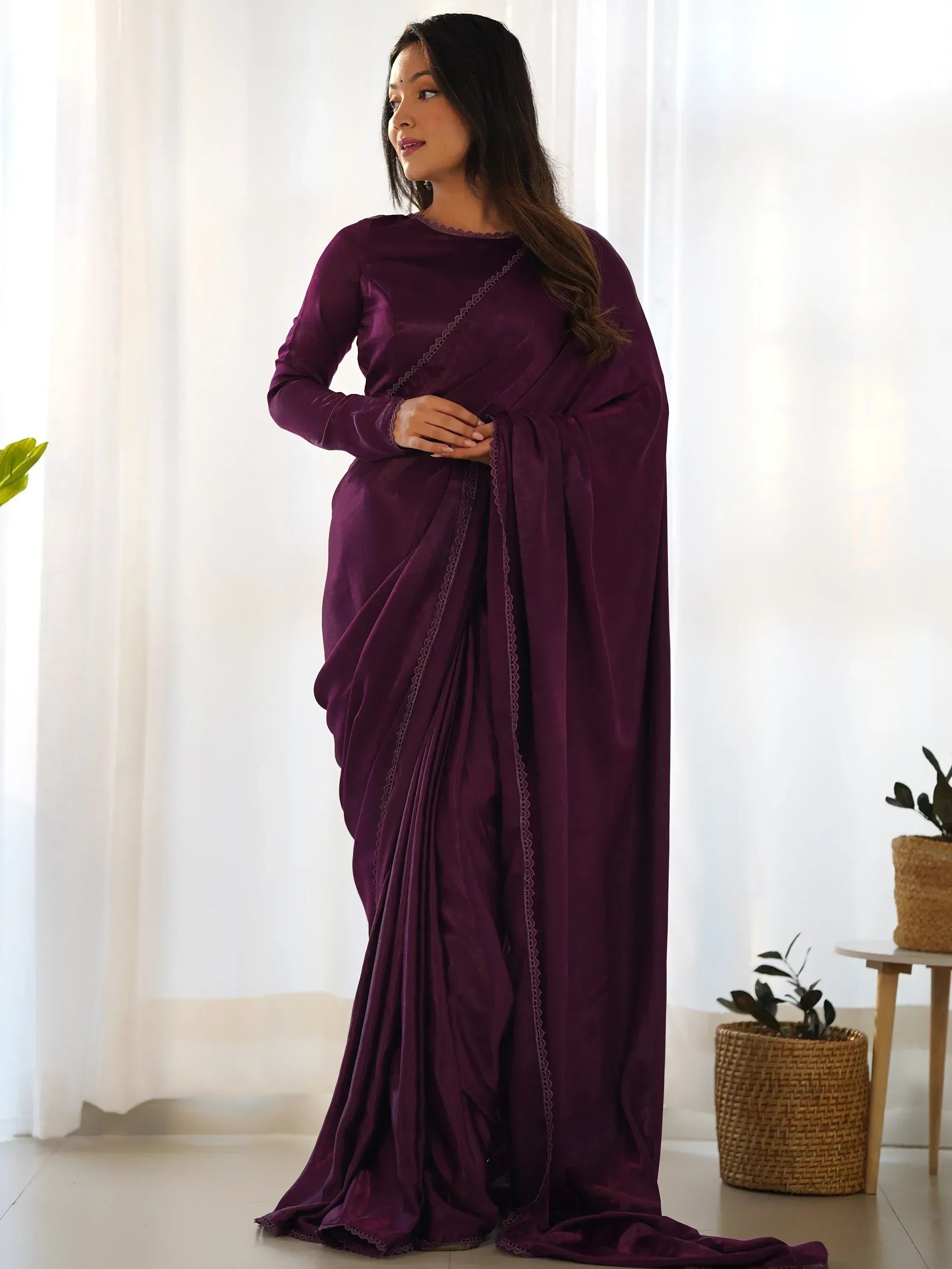 Elegant purple saree with lace detailing, perfect for ethnic occasions