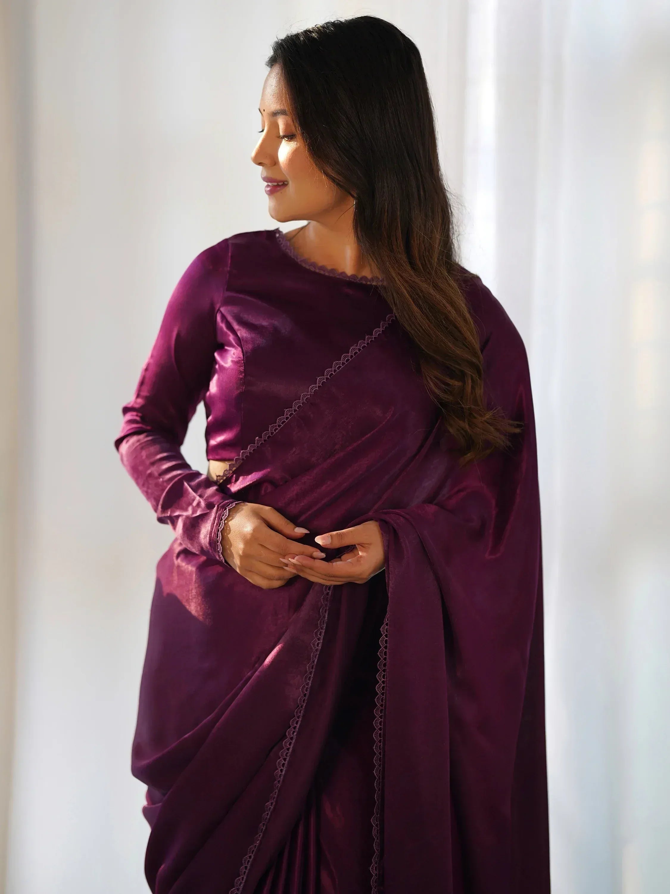 Elegant purple velvet saree with lace detailing, perfect for Indian ethnic wear occasions