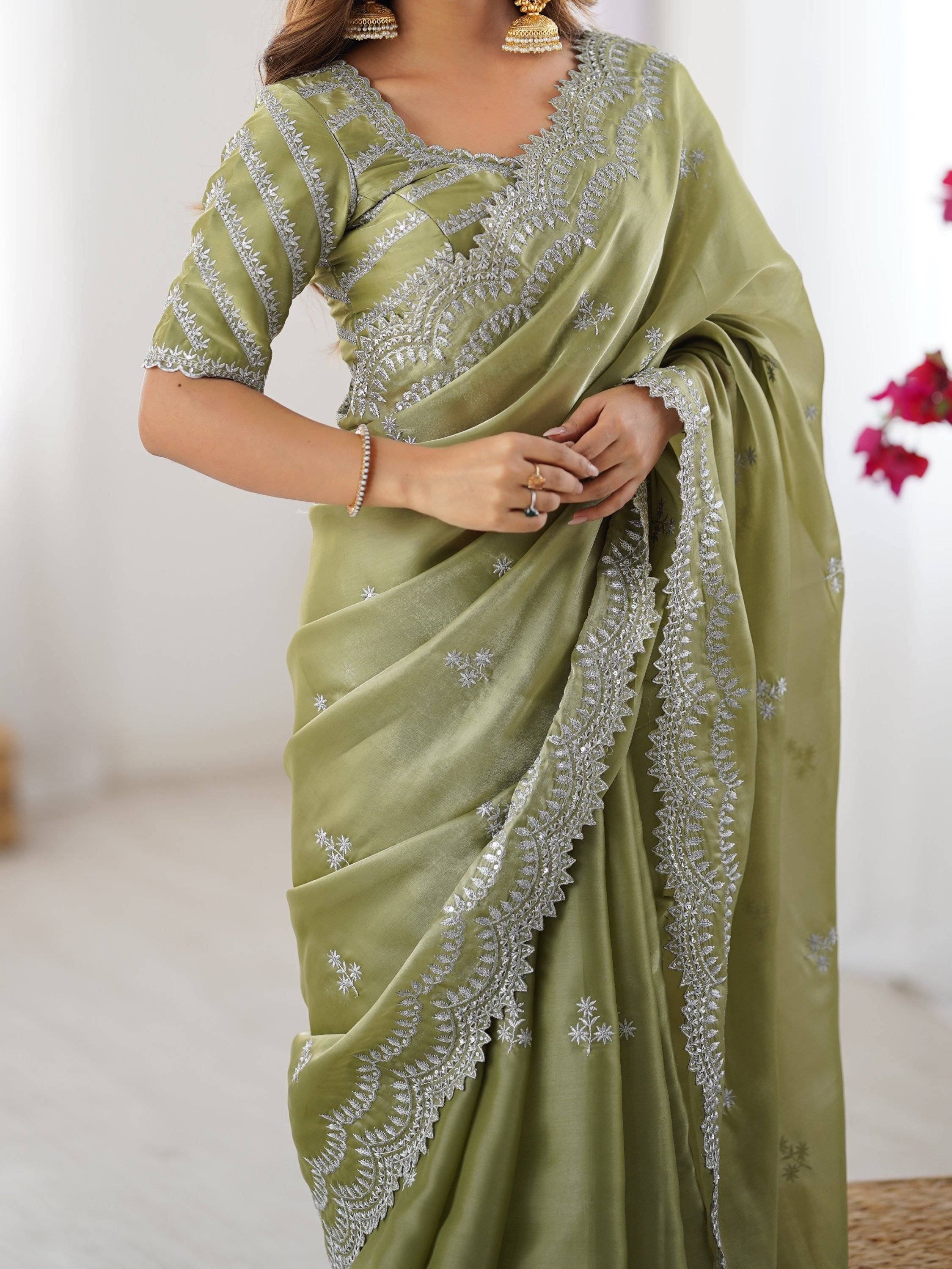 Olive green saree with silver embroidery, perfect for Indian ethnic wear and festive occasions.