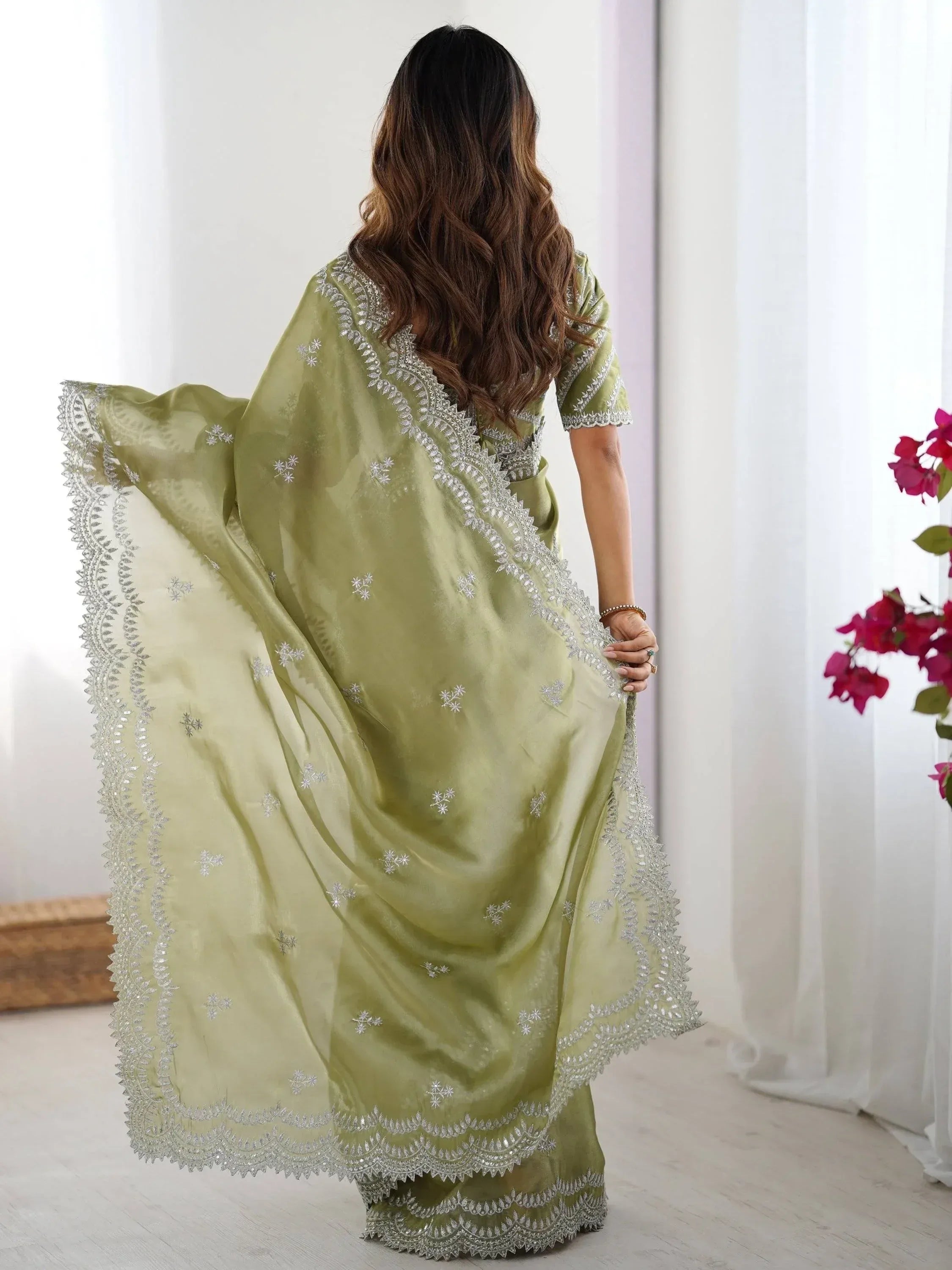 Olive green saree with silver embroidery and scalloped border, styled for Indian ethnic wear
