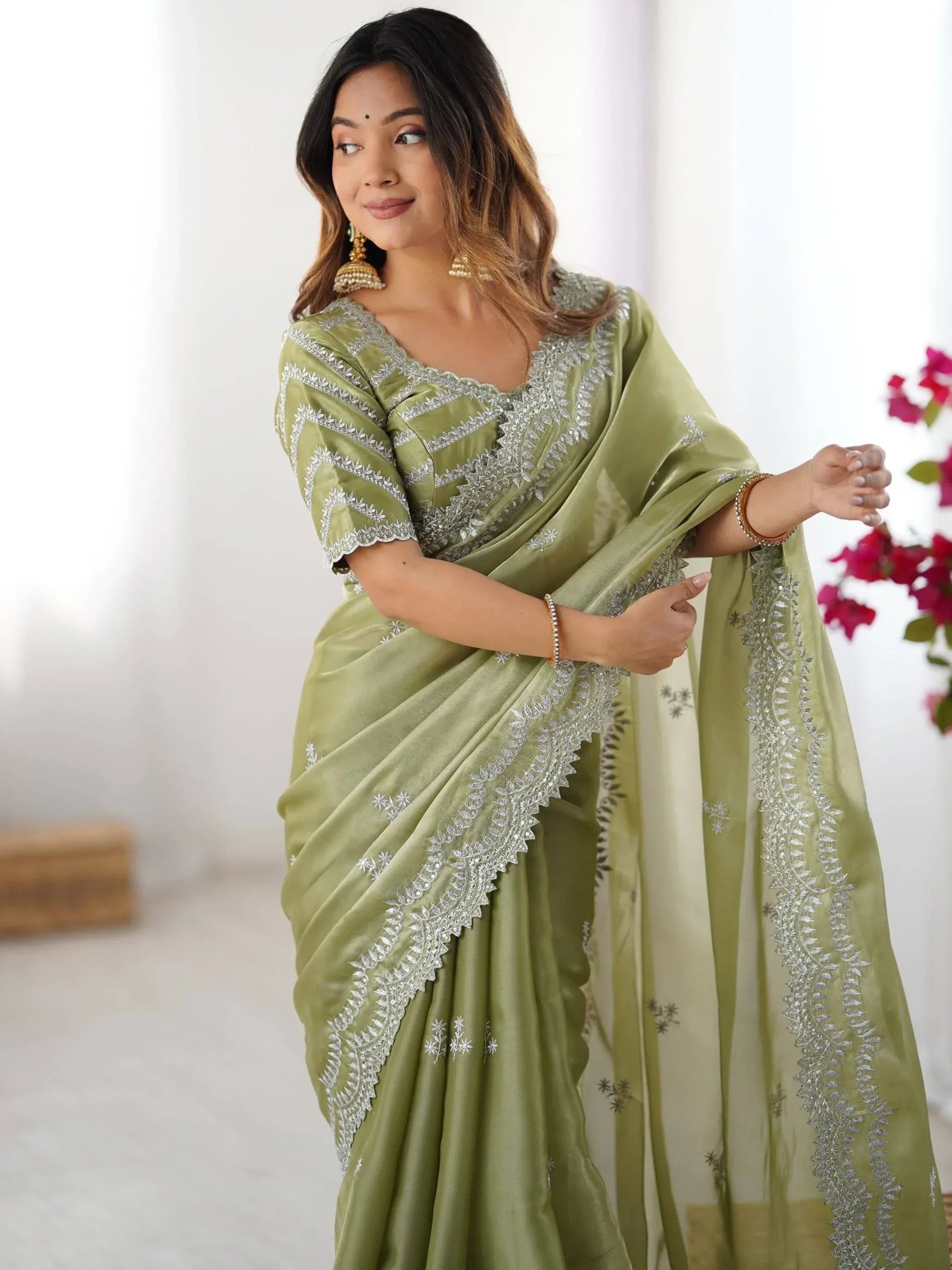Olive green designer saree with silver embroidery, perfect for Indian ethnic wear occasions