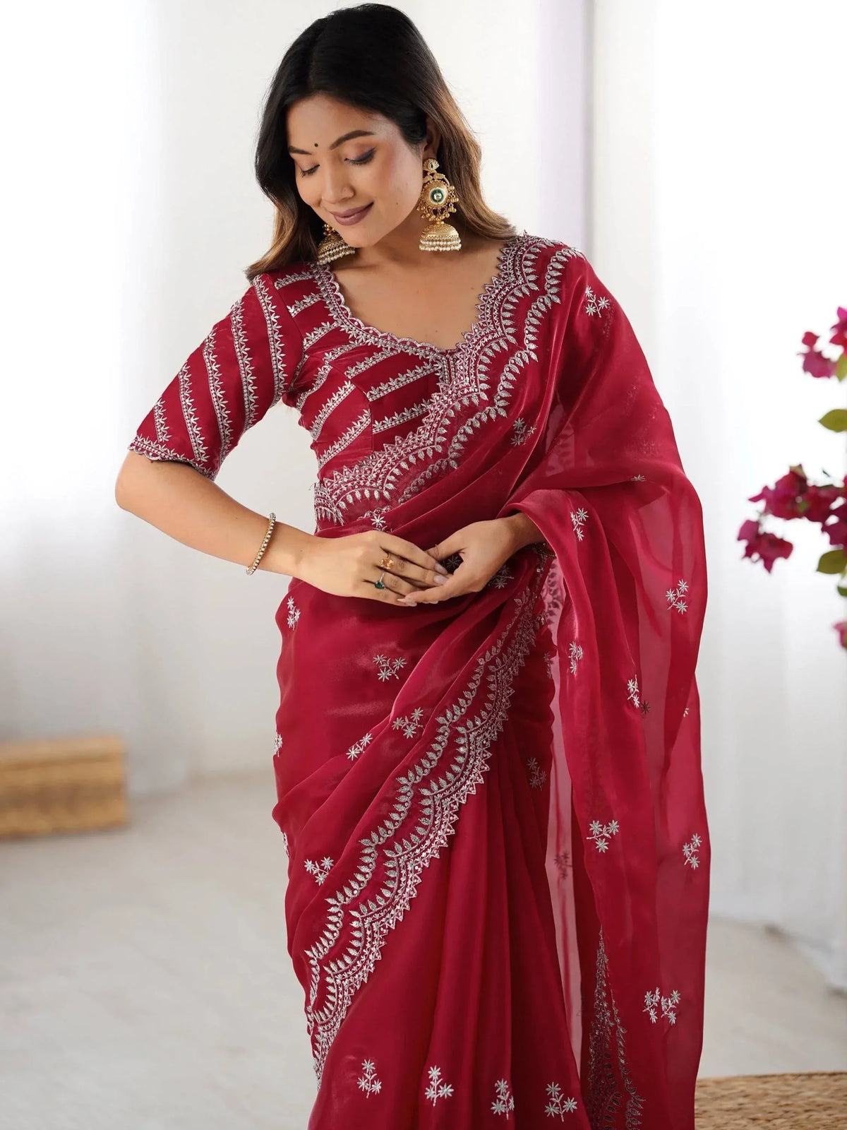 Elegant maroon saree with silver embroidery, perfect for Indian ethnic wear and festive occasions.