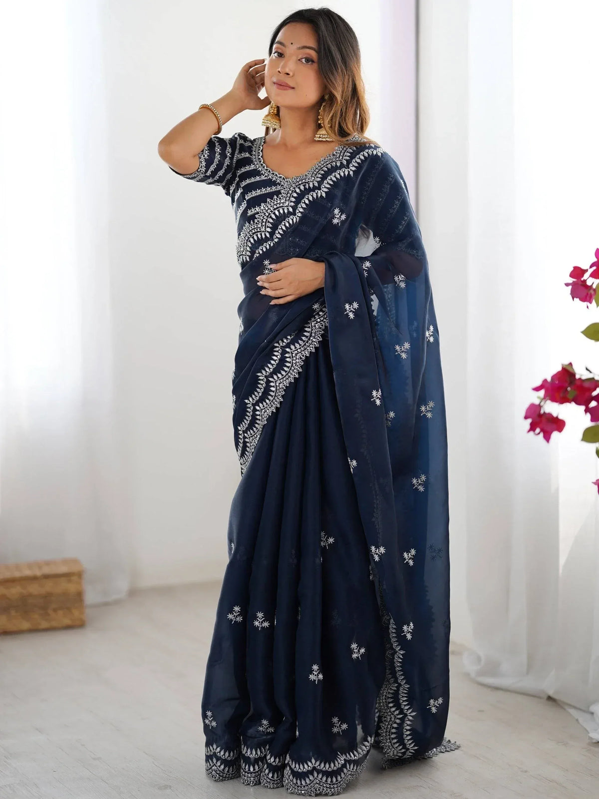 Navy blue embroidered saree with white floral motifs, perfect for Indian ethnic wear occasions