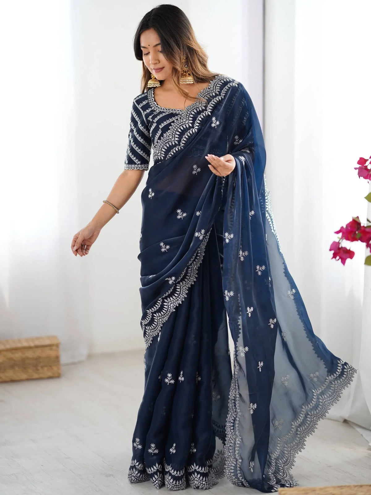 Navy blue embroidered saree with white floral motifs, perfect for Indian ethnic wear occasions