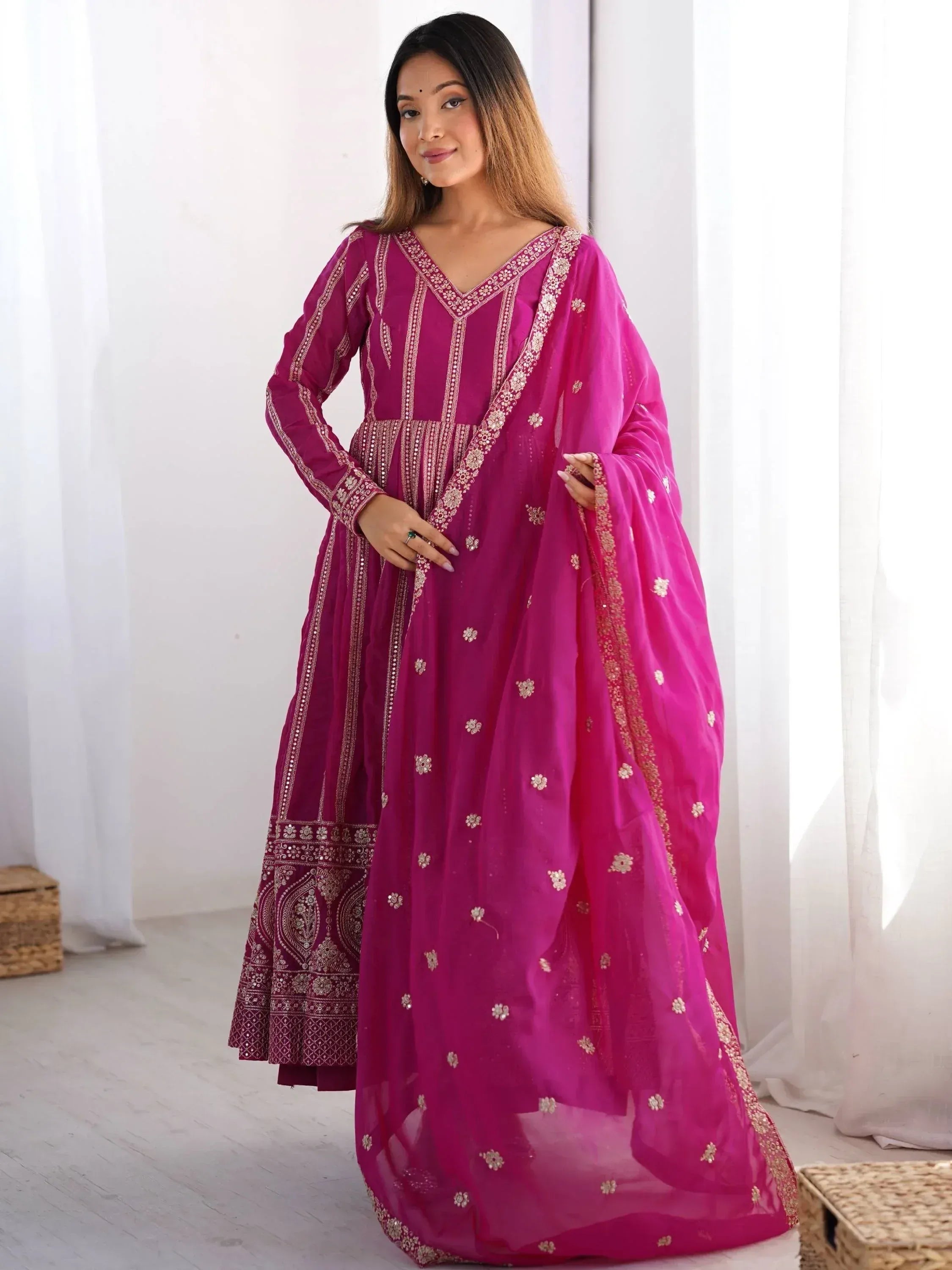Pink embroidered ethnic anarkali suit with dupatta, perfect for Indian occasions and festive wear.