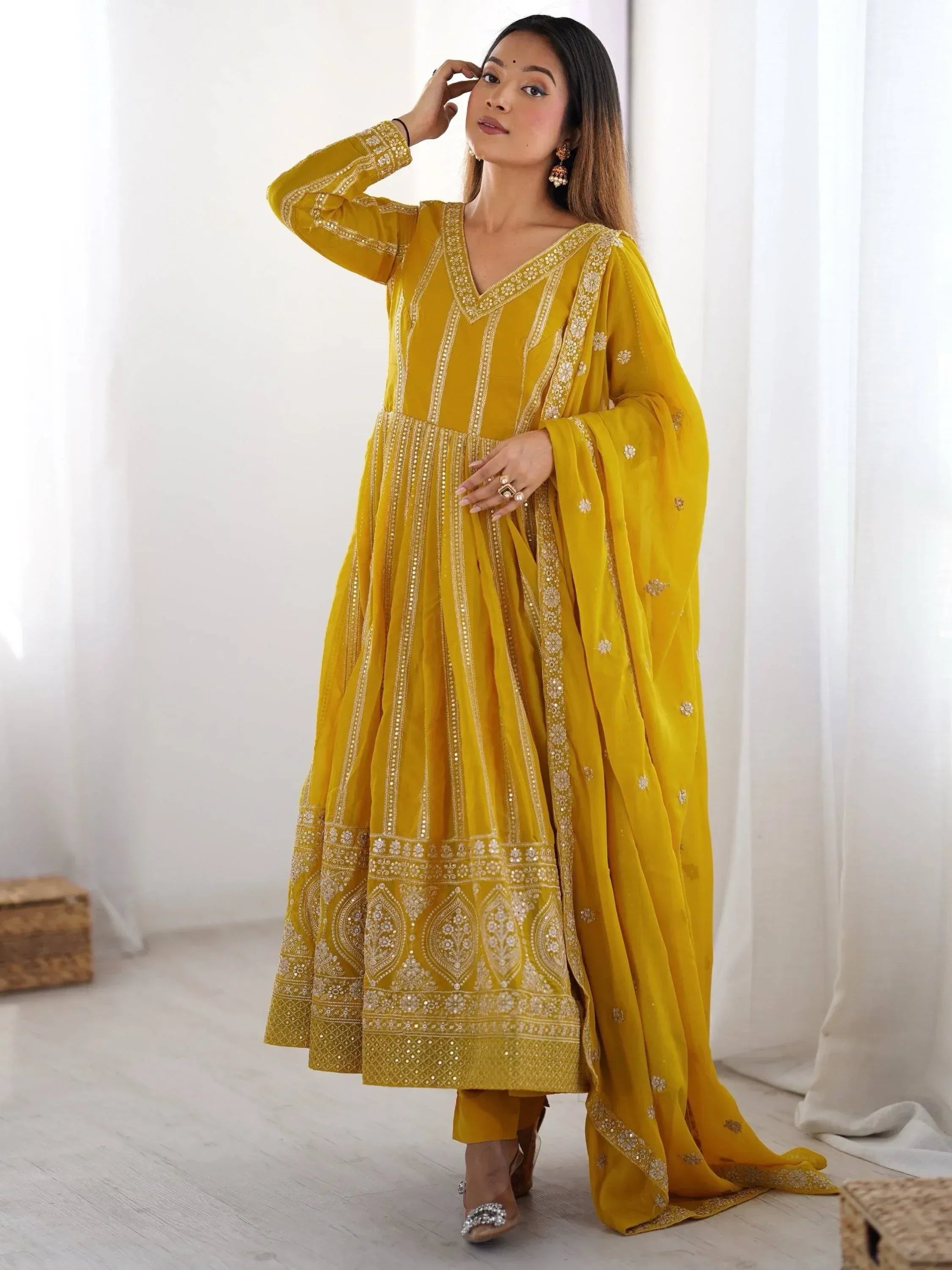 Yellow embroidered ethnic salwar kameez with matching dupatta, perfect for Indian occasions