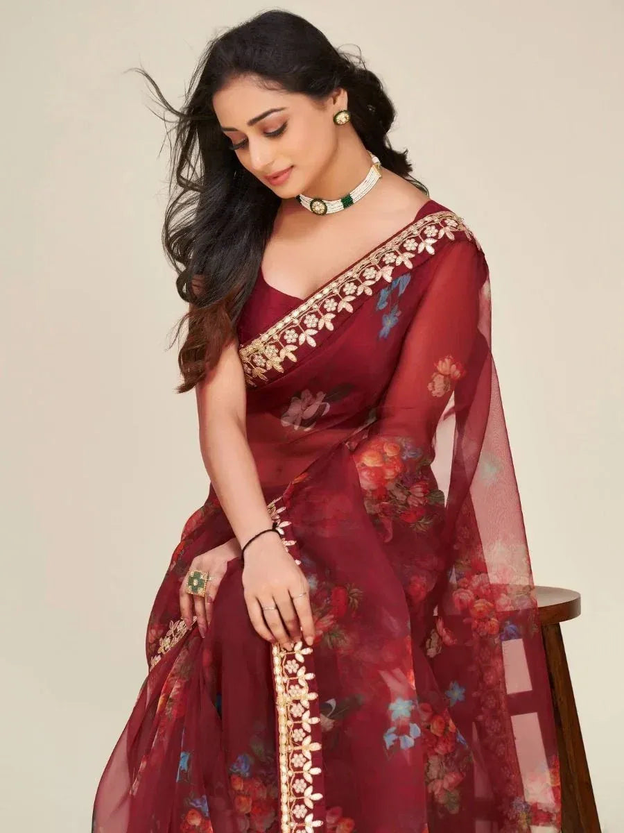 Maroon floral saree with gold embroidery, perfect for Indian ethnic wear occasions