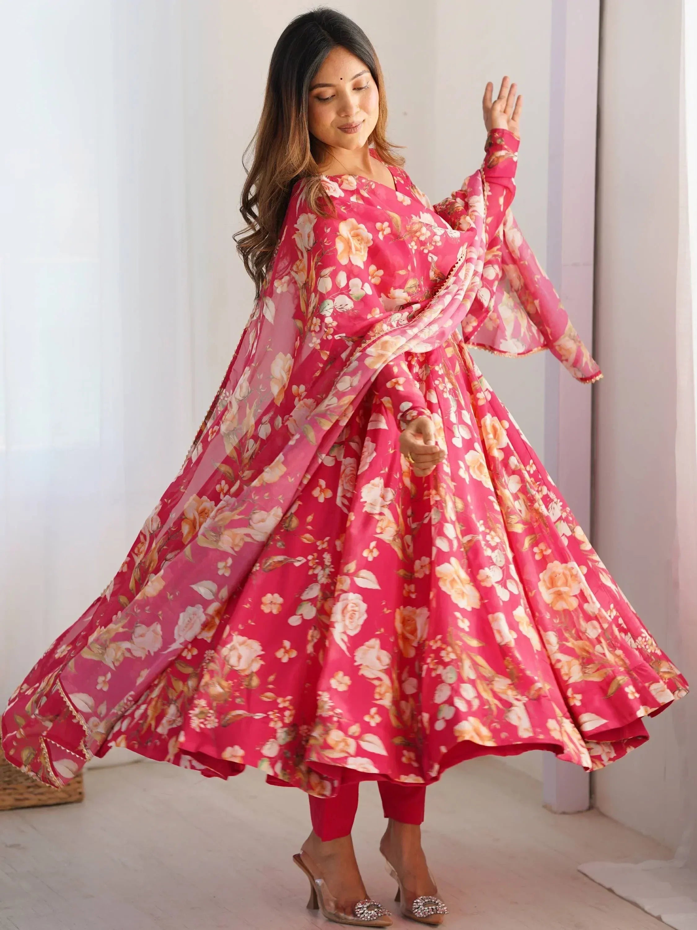 Pink floral anarkali suit with flared sleeves and matching dupatta, perfect for Indian ethnic occasions