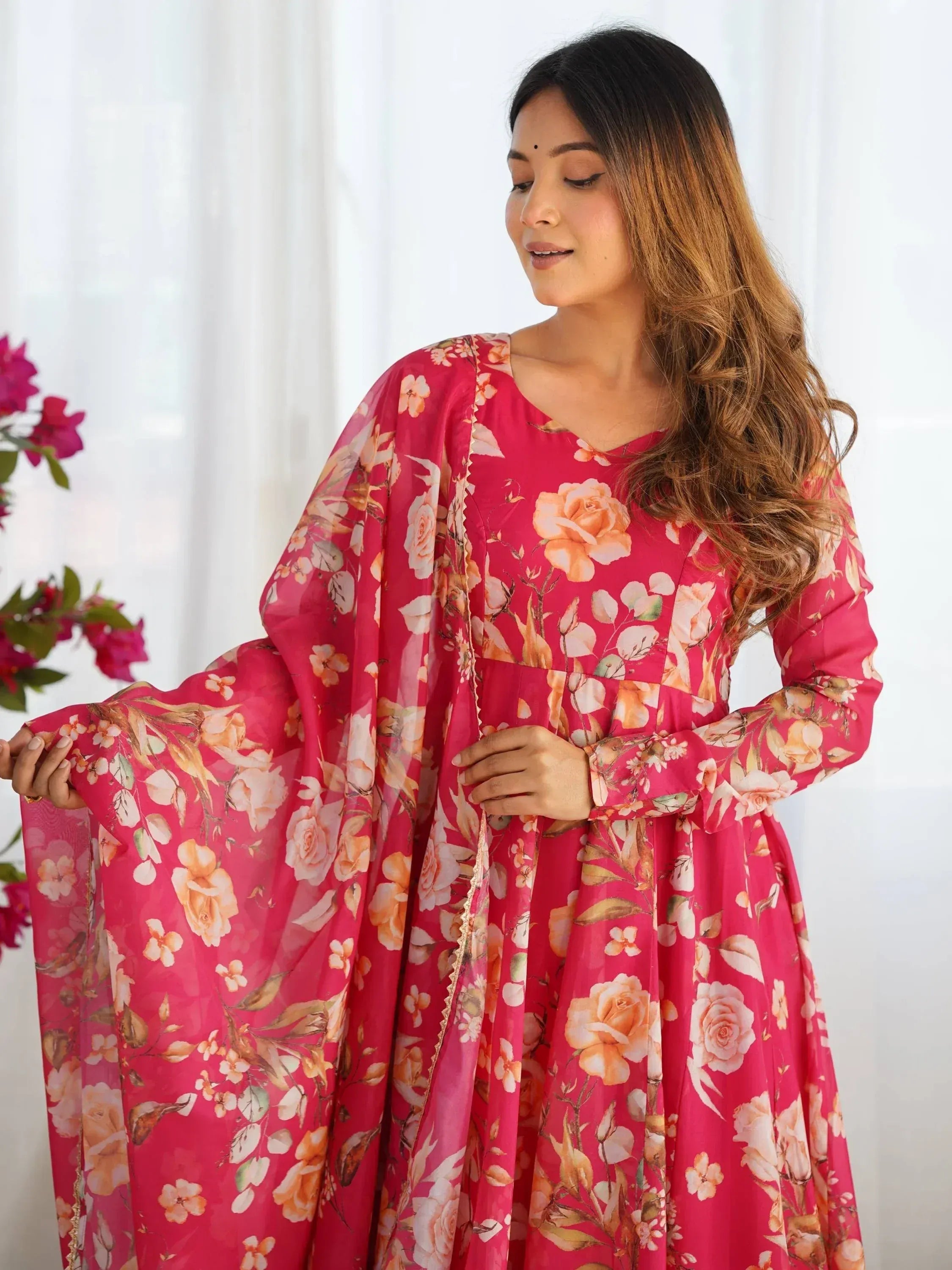 Pink floral print ethnic gown with long sleeves and flared skirt, perfect for Indian occasions