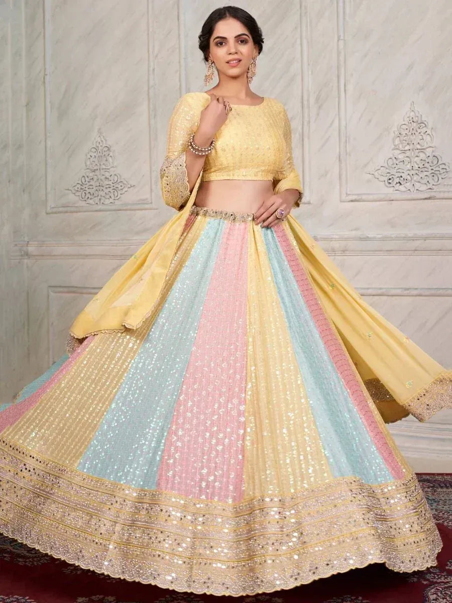 Yellow, pink, and mint pastel lehenga choli with sequin embroidery, perfect for Indian ethnic wear events.