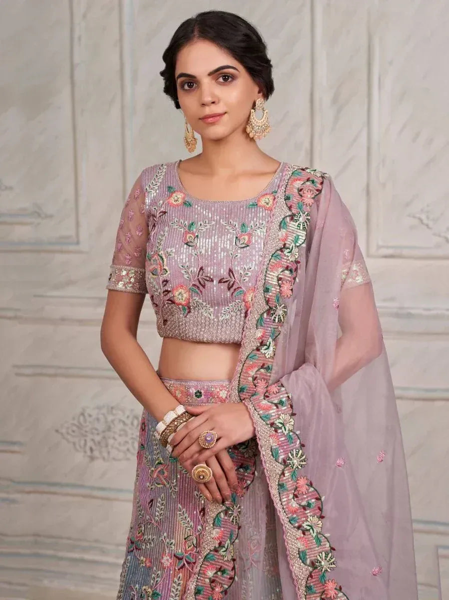 Elegant lavender lehenga choli with floral embroidery and sheer dupatta, perfect for Indian ethnic occasions