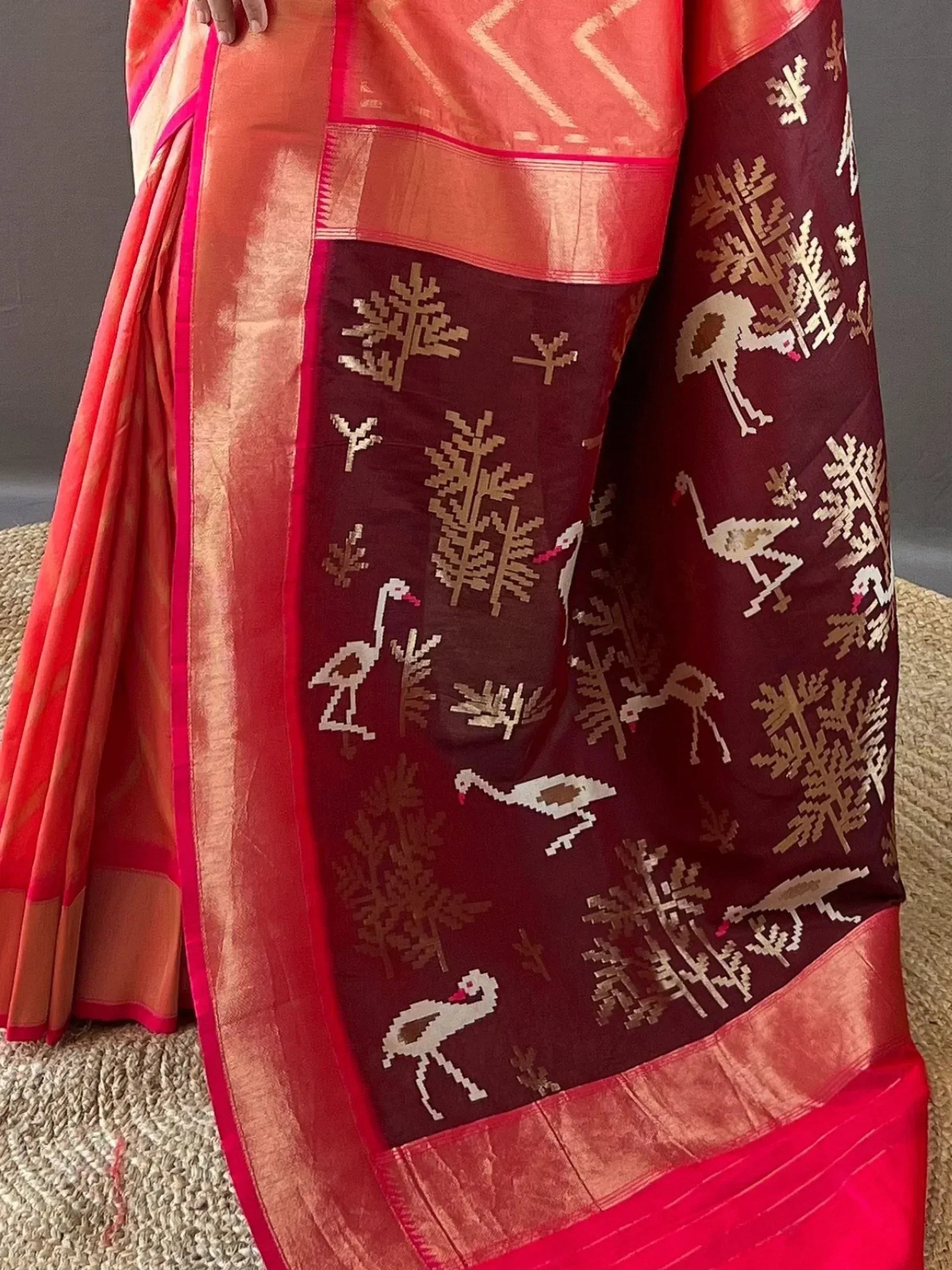 Red and maroon ethnic saree with bird and tree motifs, perfect for Indian festive occasions