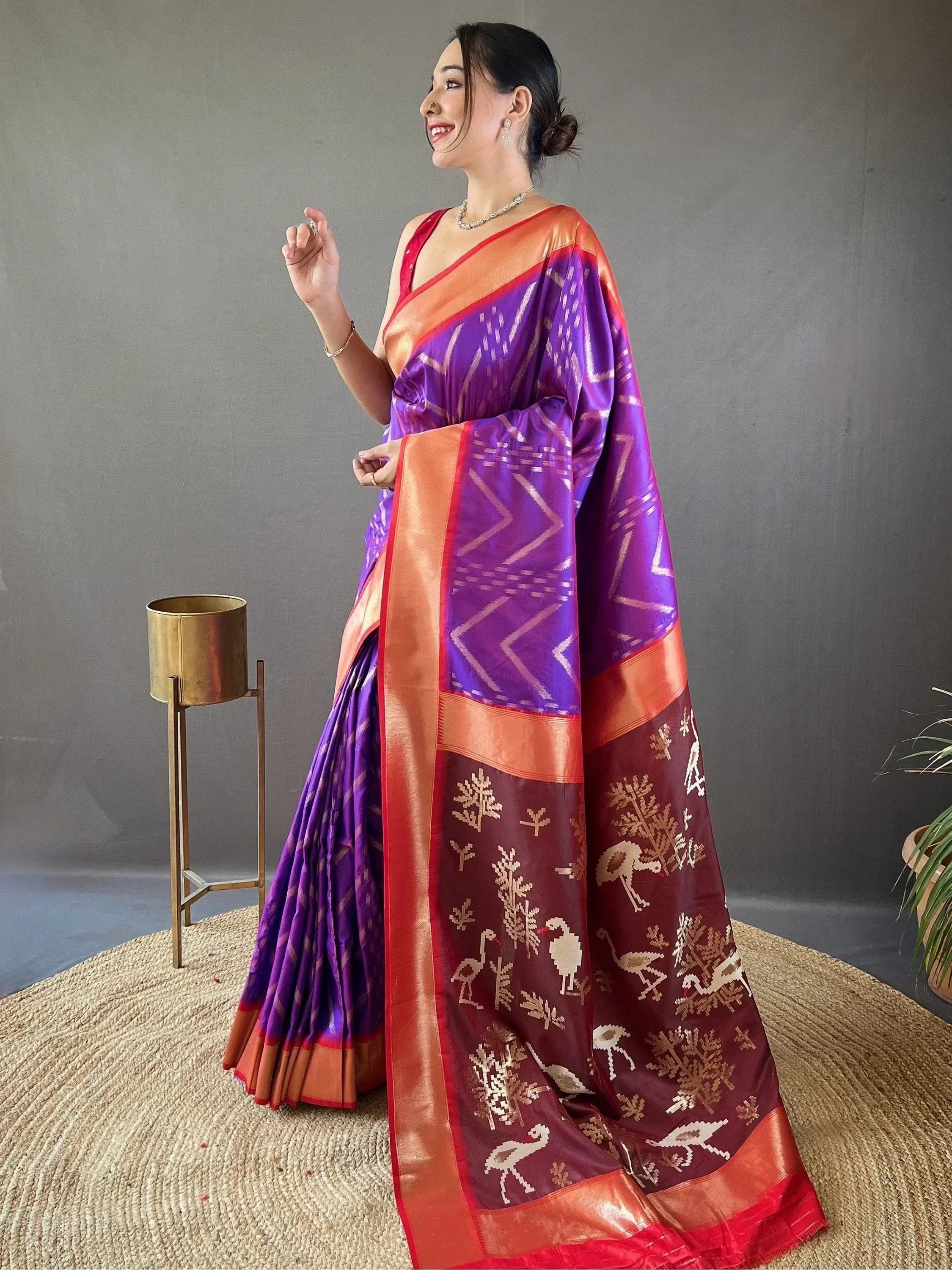 Purple and maroon ikat saree with bird motifs, perfect for ethnic occasions