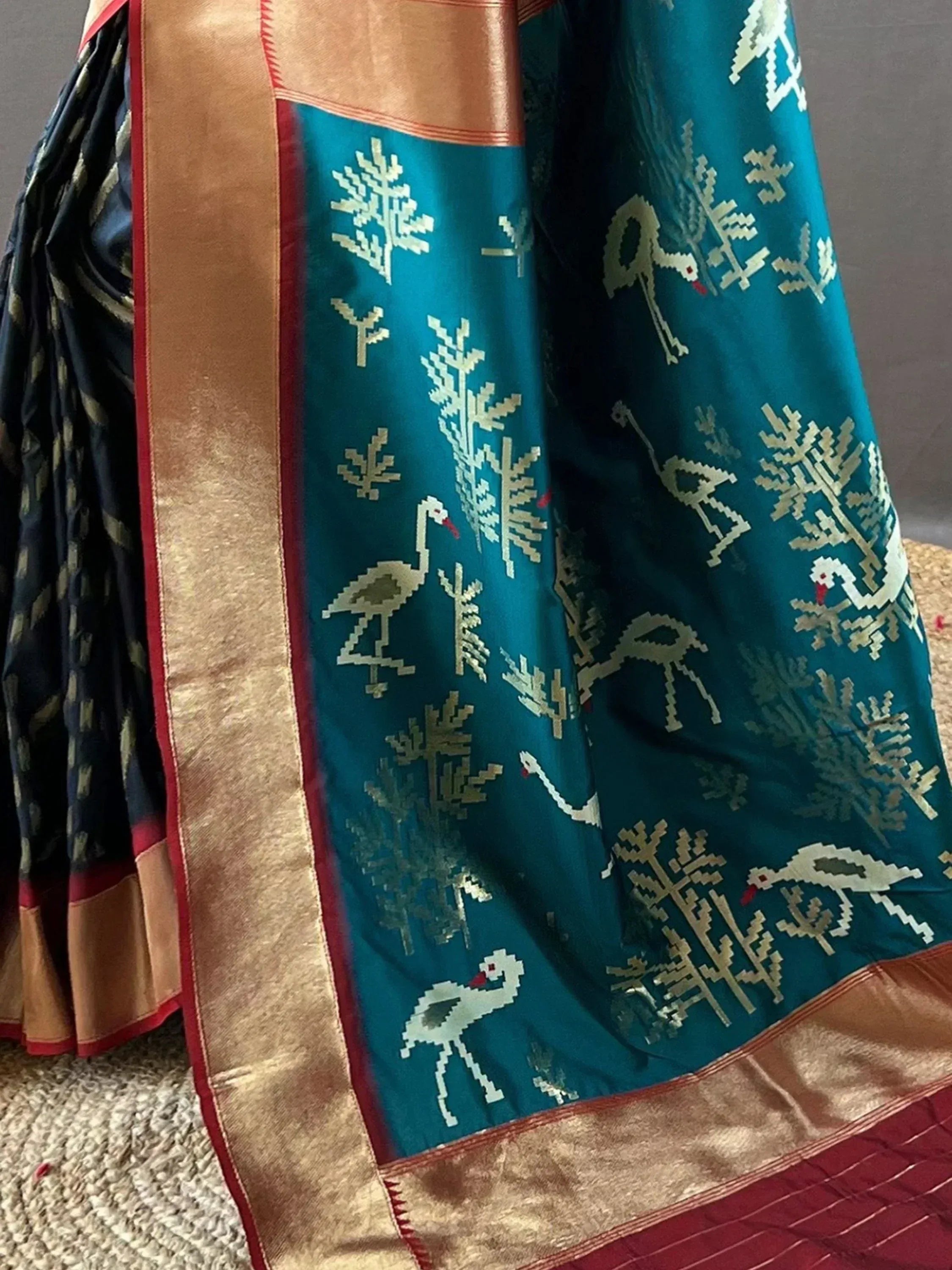 Teal saree with bird and tree motifs, gold border, ethnic Indian wear