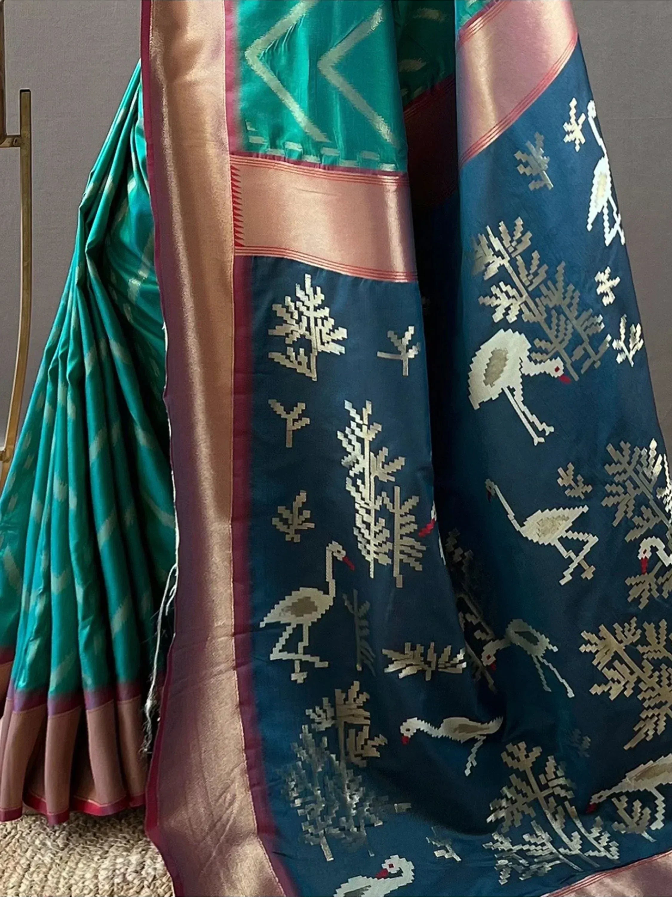 Teal and navy blue saree with bird and tree motifs, gold border, Indian ethnic wear