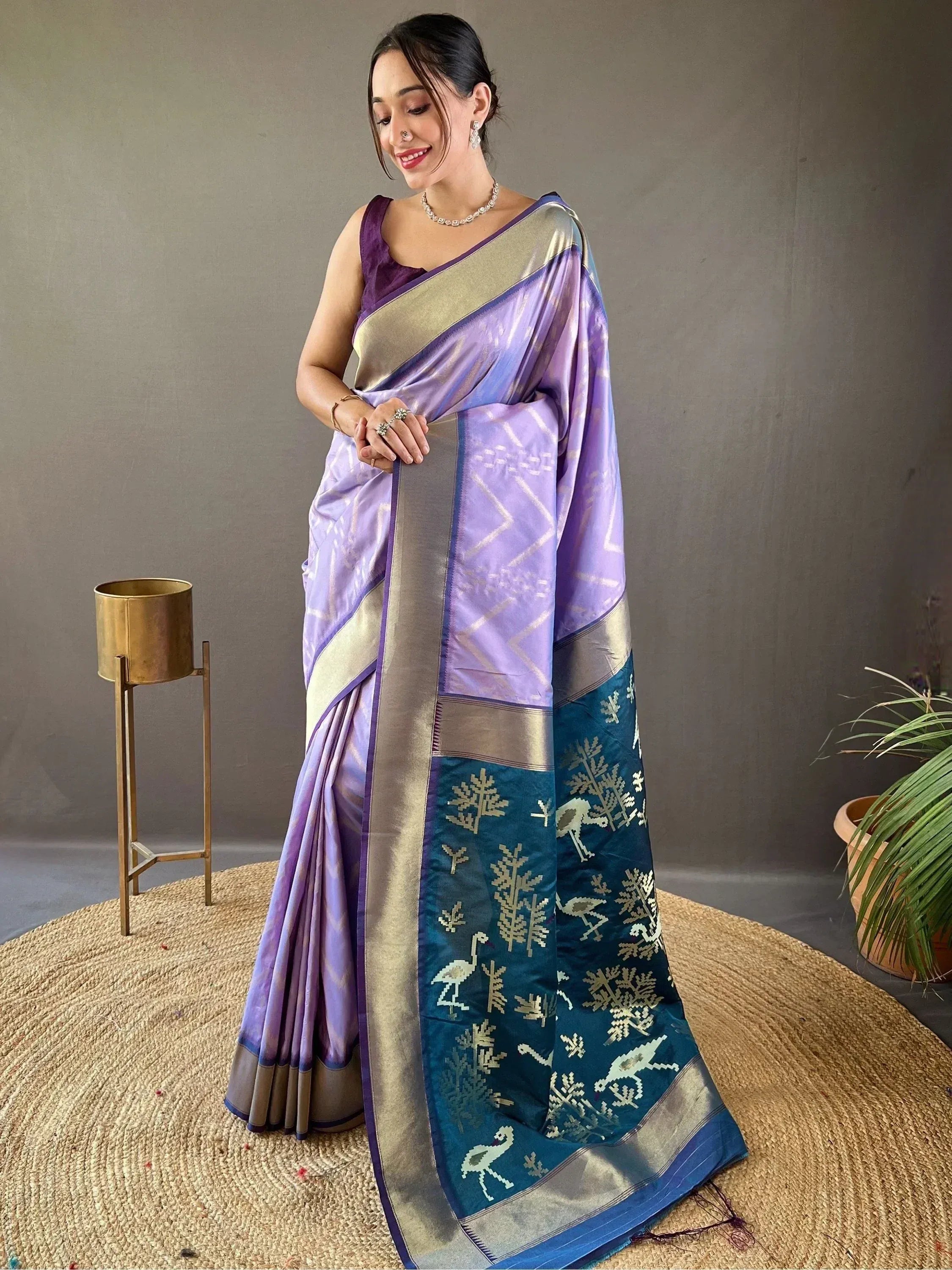 Purple and teal designer saree with gold embroidery, perfect for ethnic occasions