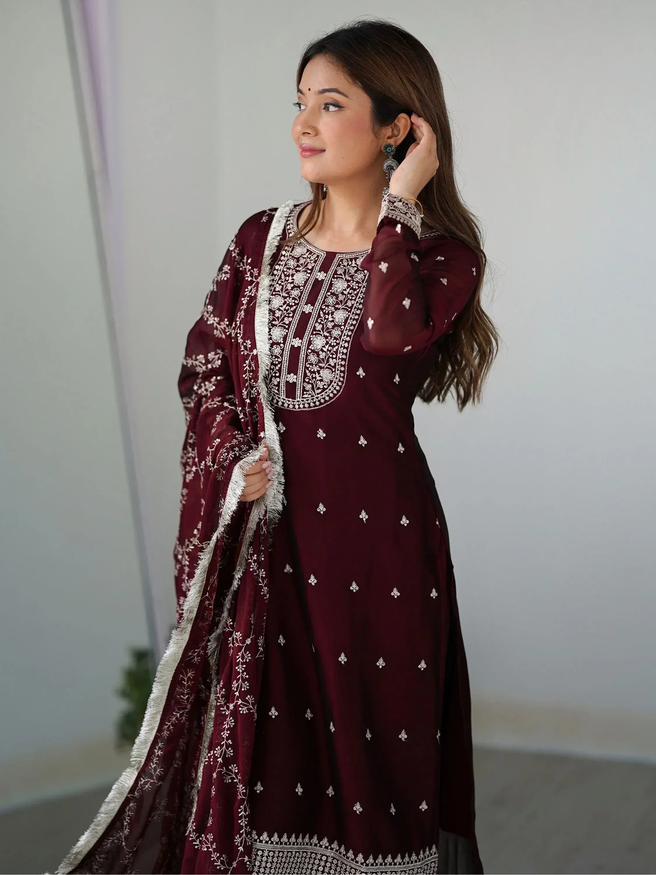 Maroon embroidered salwar kameez with white floral detailing and matching dupatta, ideal for ethnic occasions.