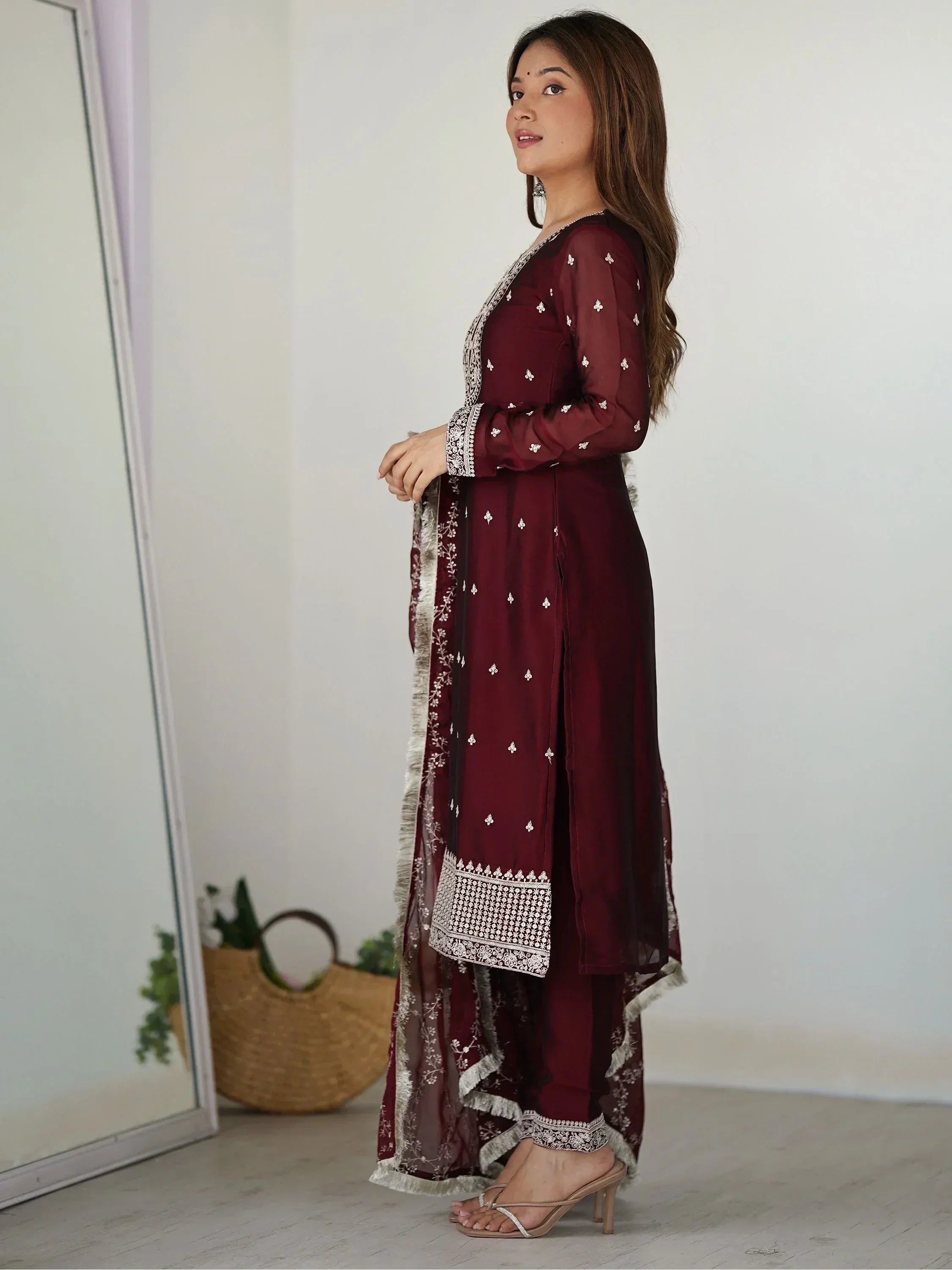 Maroon ethnic salwar kameez with white embroidery and sheer dupatta, perfect for Indian festive wear