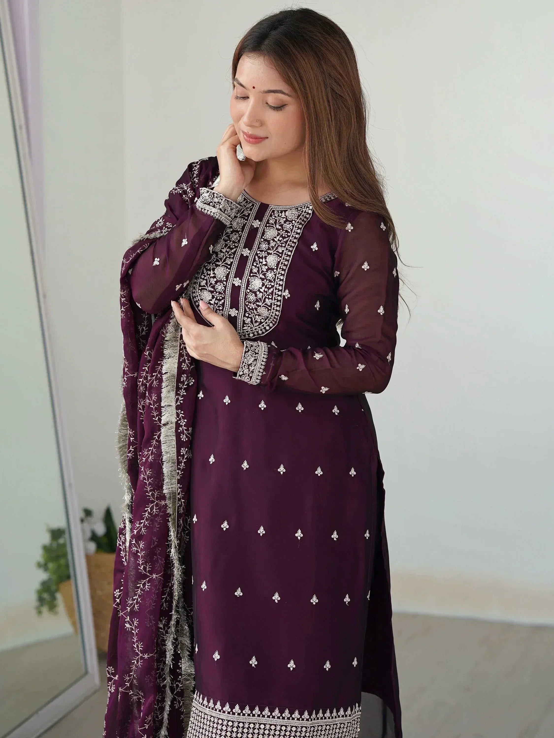 Elegant maroon salwar kameez with white embroidery and matching dupatta, perfect for ethnic occasions.
