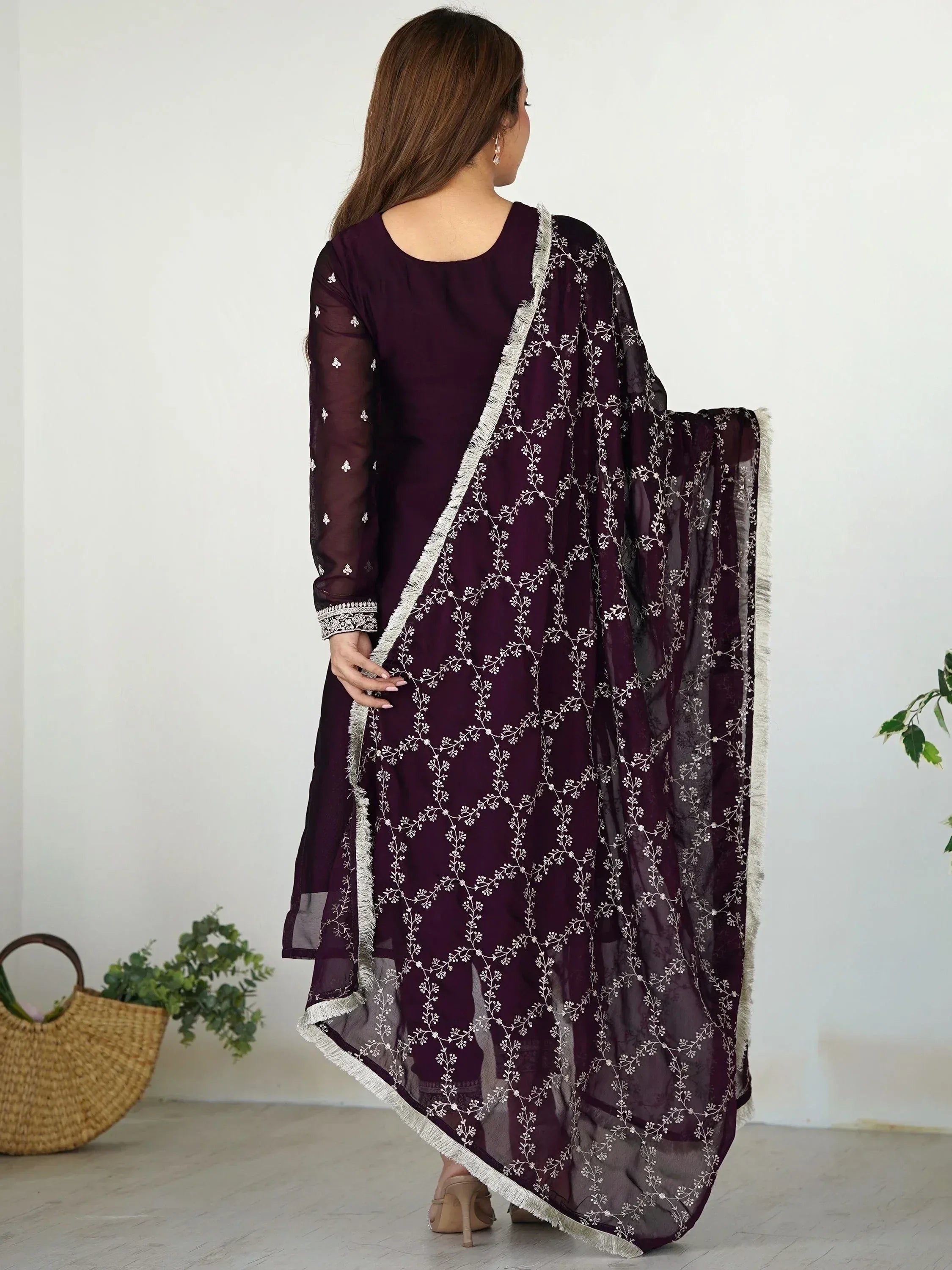 Elegant purple ethnic salwar kameez with white floral embroidery and sheer dupatta, perfect for festive occasions.