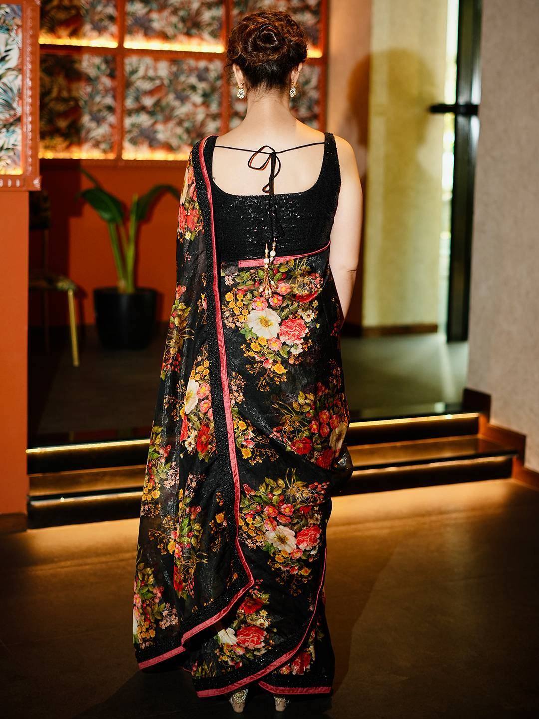 Black floral saree with pink border, back view, ethnic wear for women
