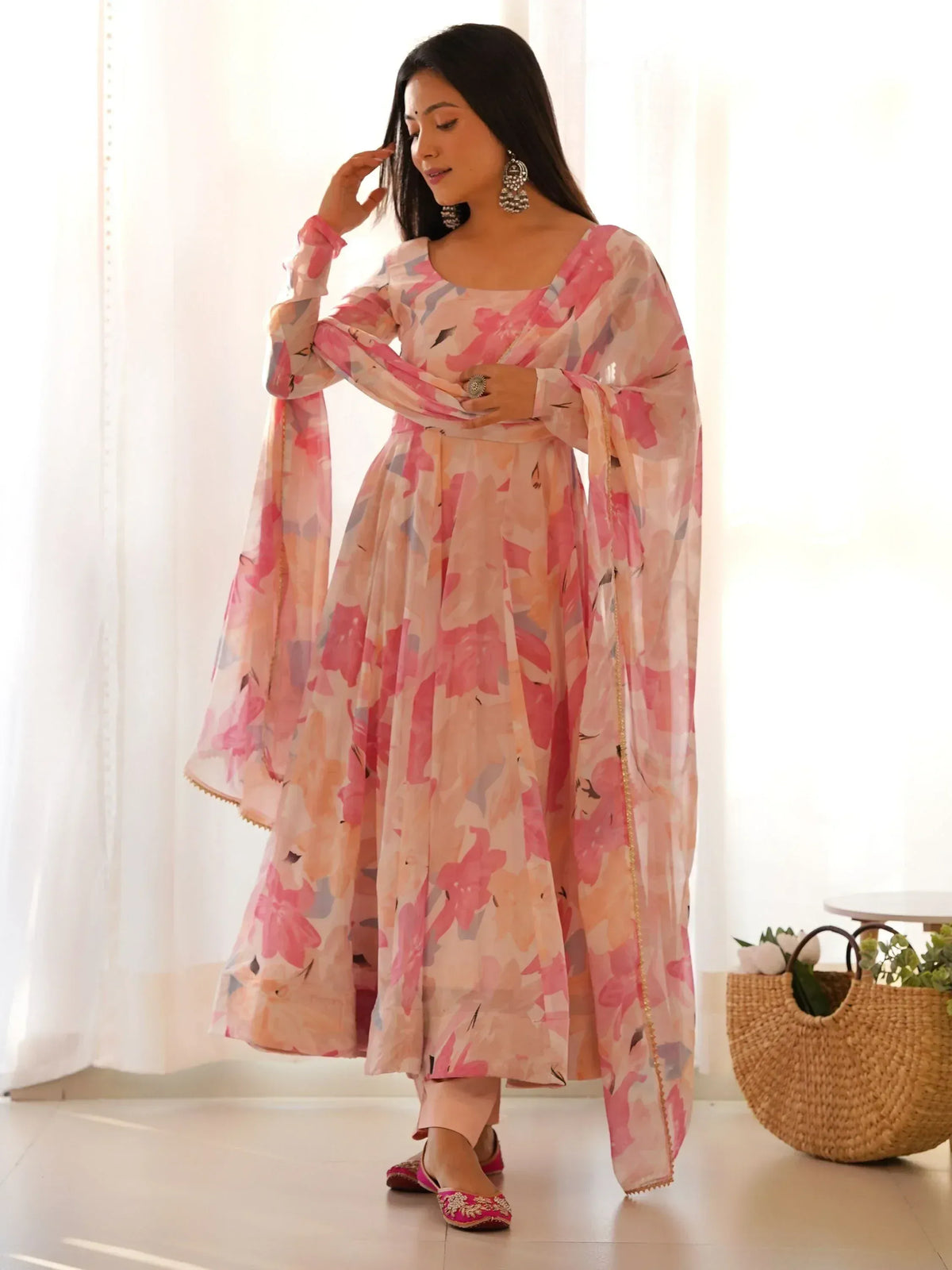 Pink floral print Indian ethnic anarkali suit with sheer dupatta, perfect for festive occasions