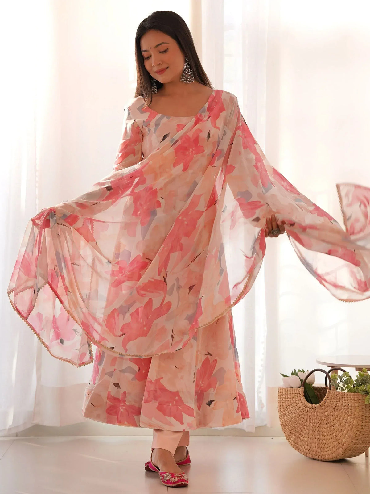 Woman in floral print Indian salwar kameez with flowing dupatta, ethnic wear for women