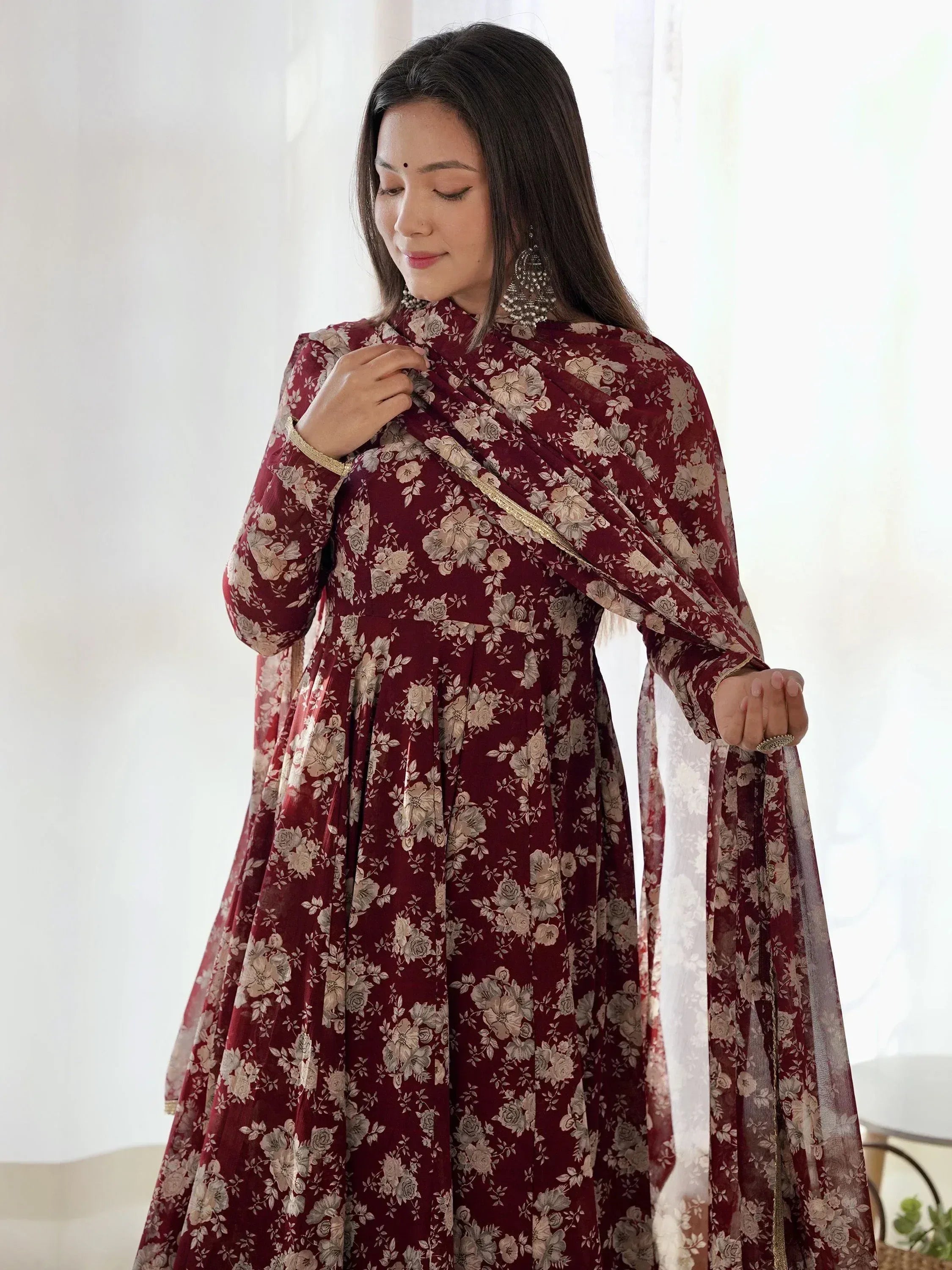Maroon floral printed ethnic anarkali suit with gold trim, perfect for Indian occasions