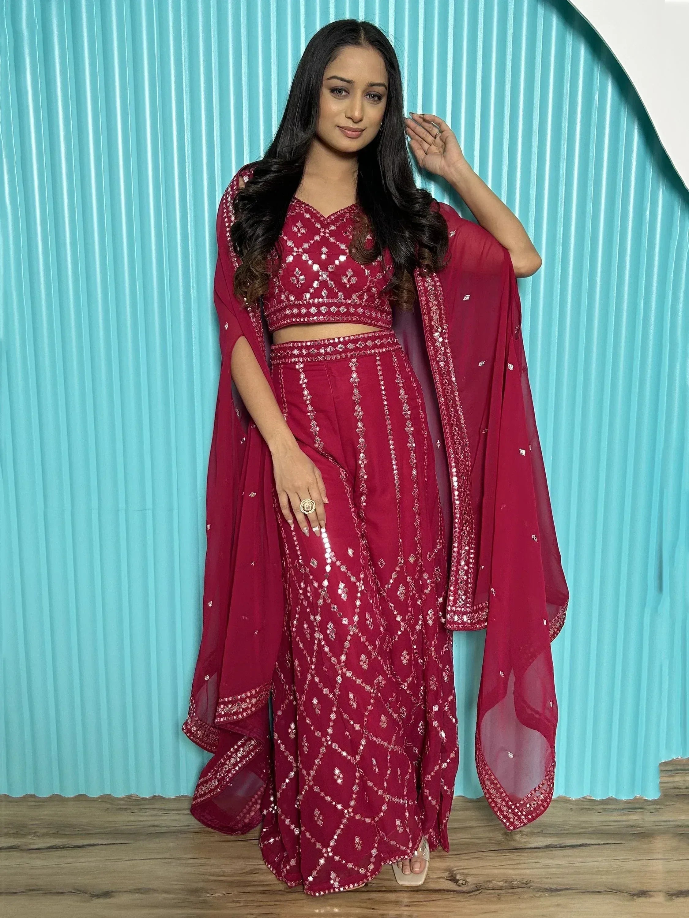 Burgundy ethnic lehenga choli with mirror work and sheer dupatta, perfect for Indian weddings and parties
