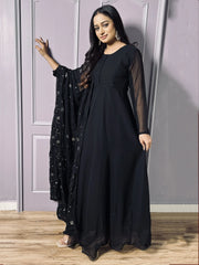 Woman in black ethnic gown with sheer sleeves and embroidered dupatta, Indian designer wear