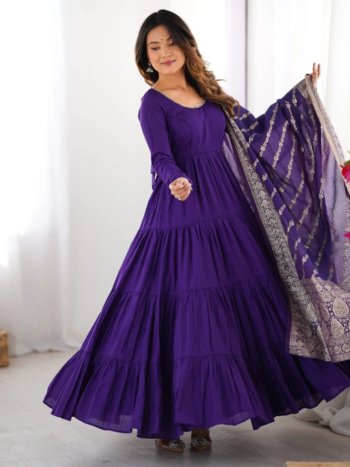 Purple tiered ethnic gown with embroidered dupatta, perfect for Indian occasions and festive wear